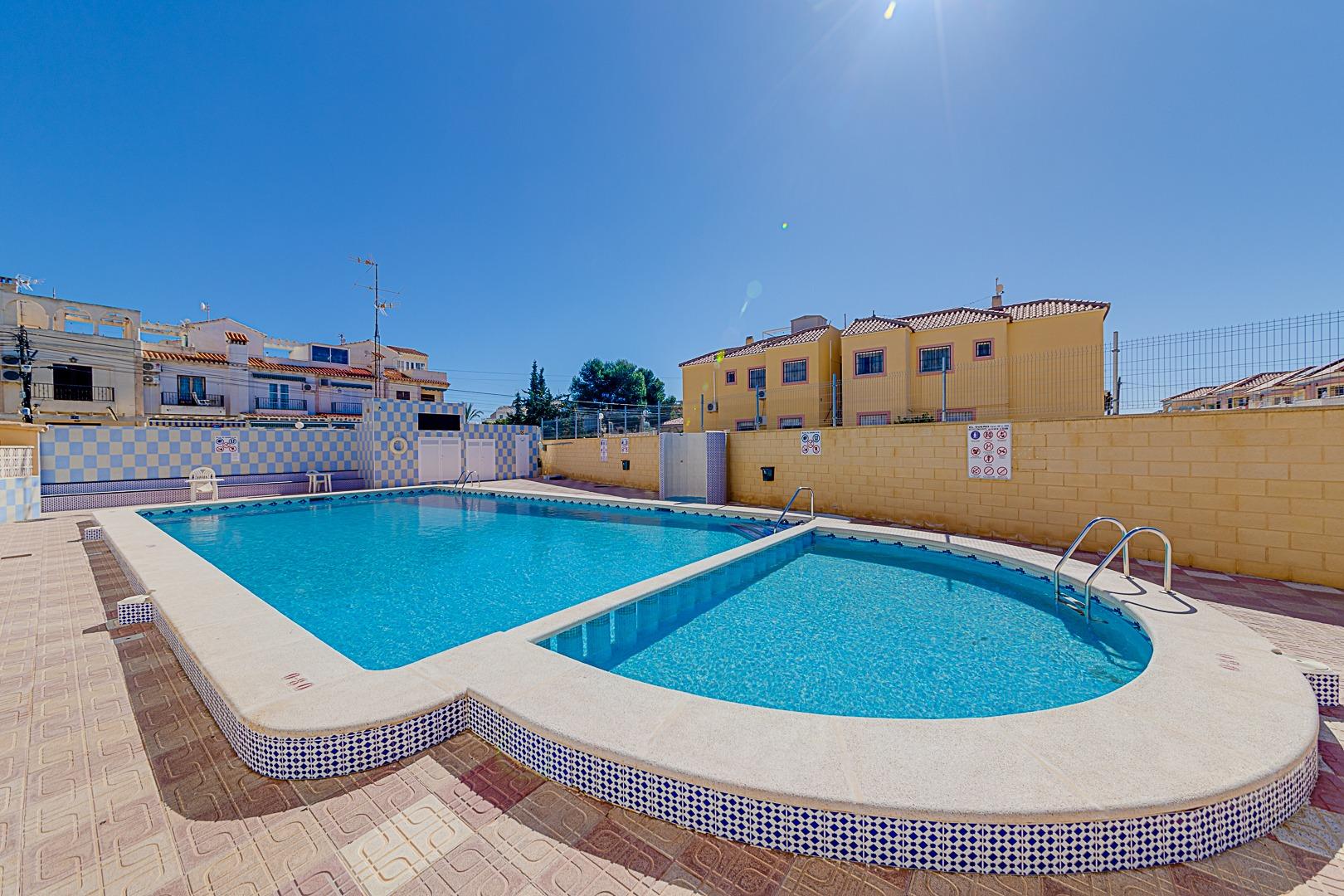 Communal pool viewed from pool level, La Siesta bungalow development