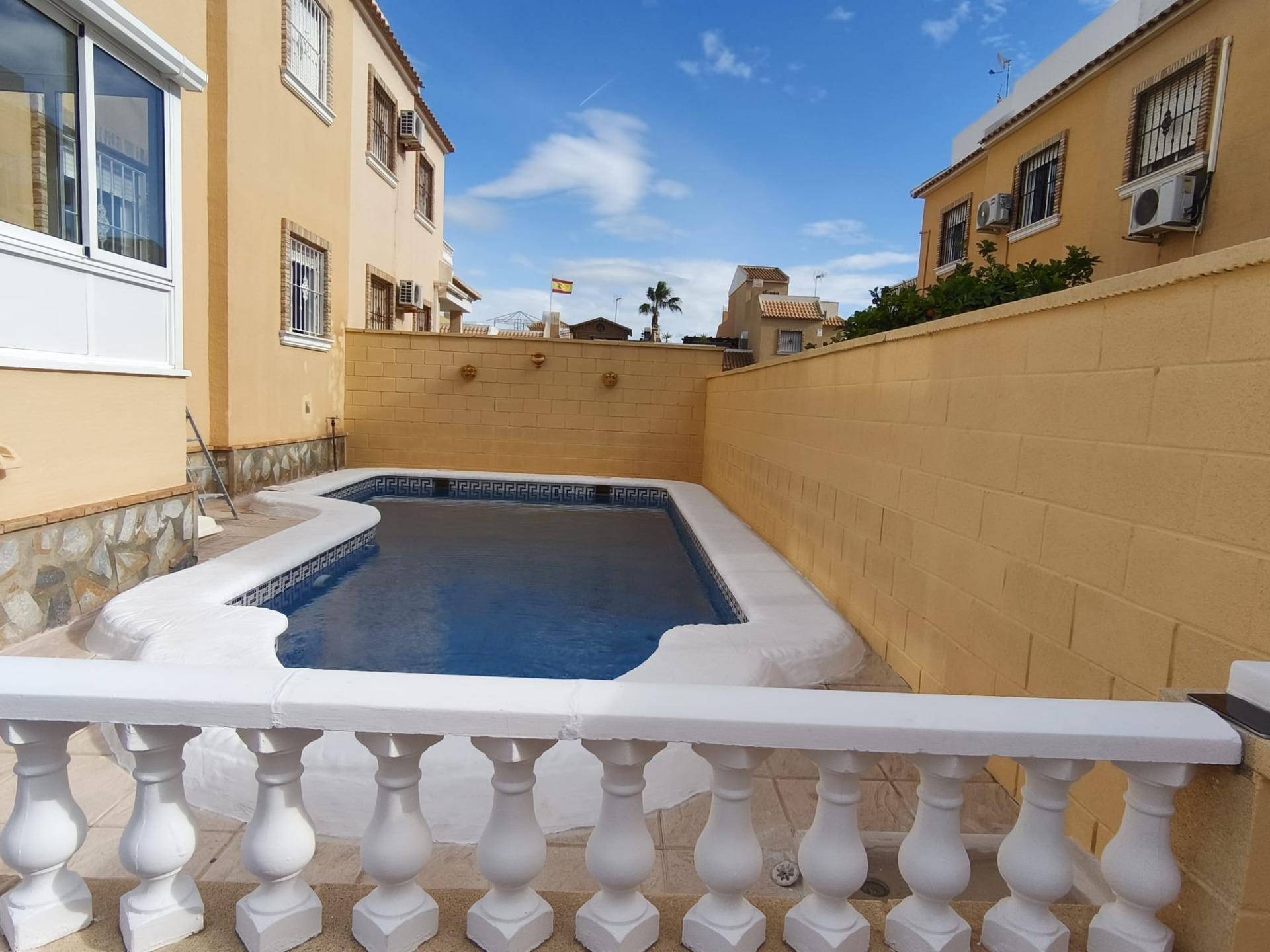 Private pool and garden area viewed from ground level, 3-bedroom villa in Lo Marabú