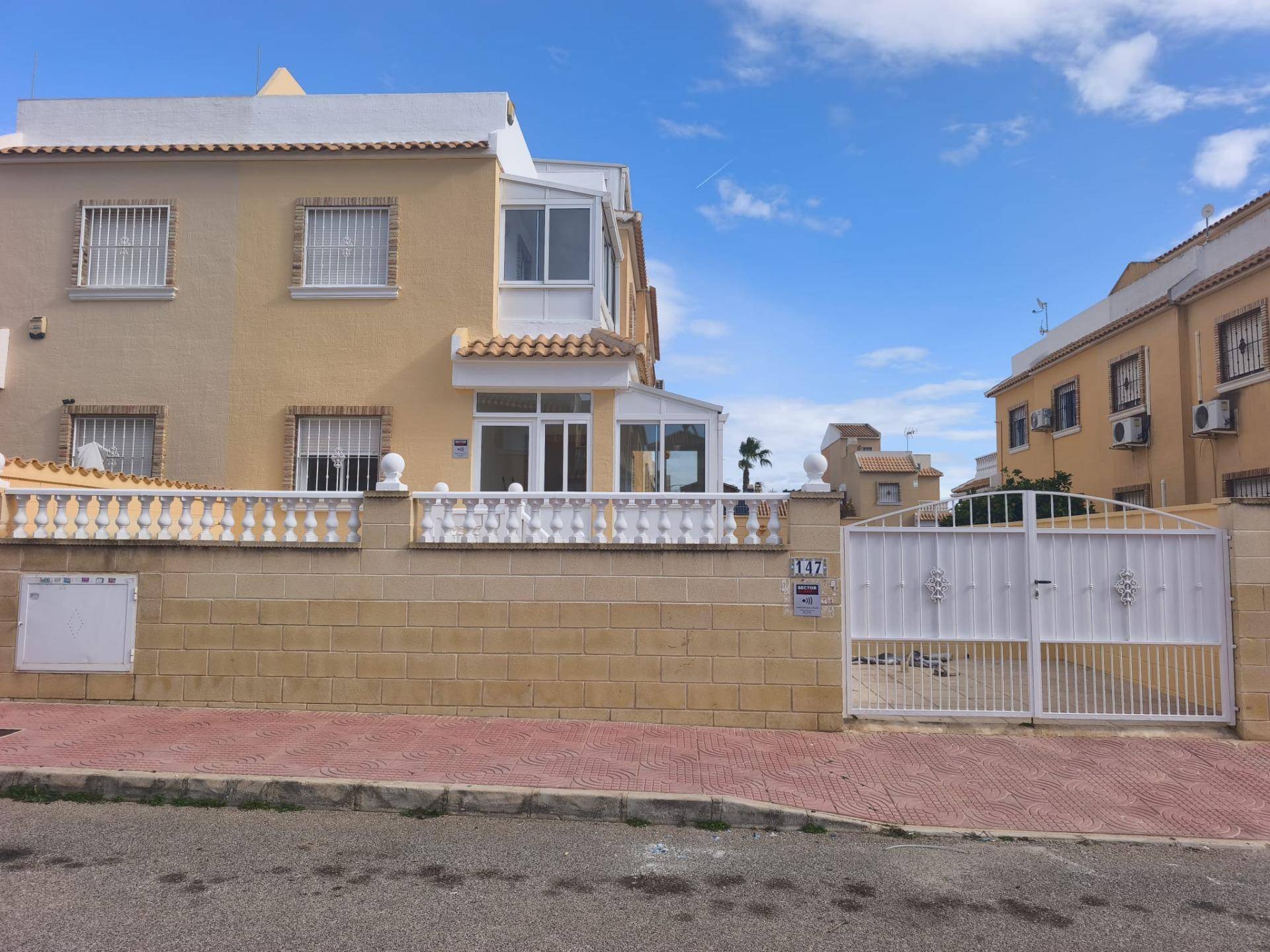 Renovated kitchen with black marble worktop and white upper and lower units, Lo Marabú villa