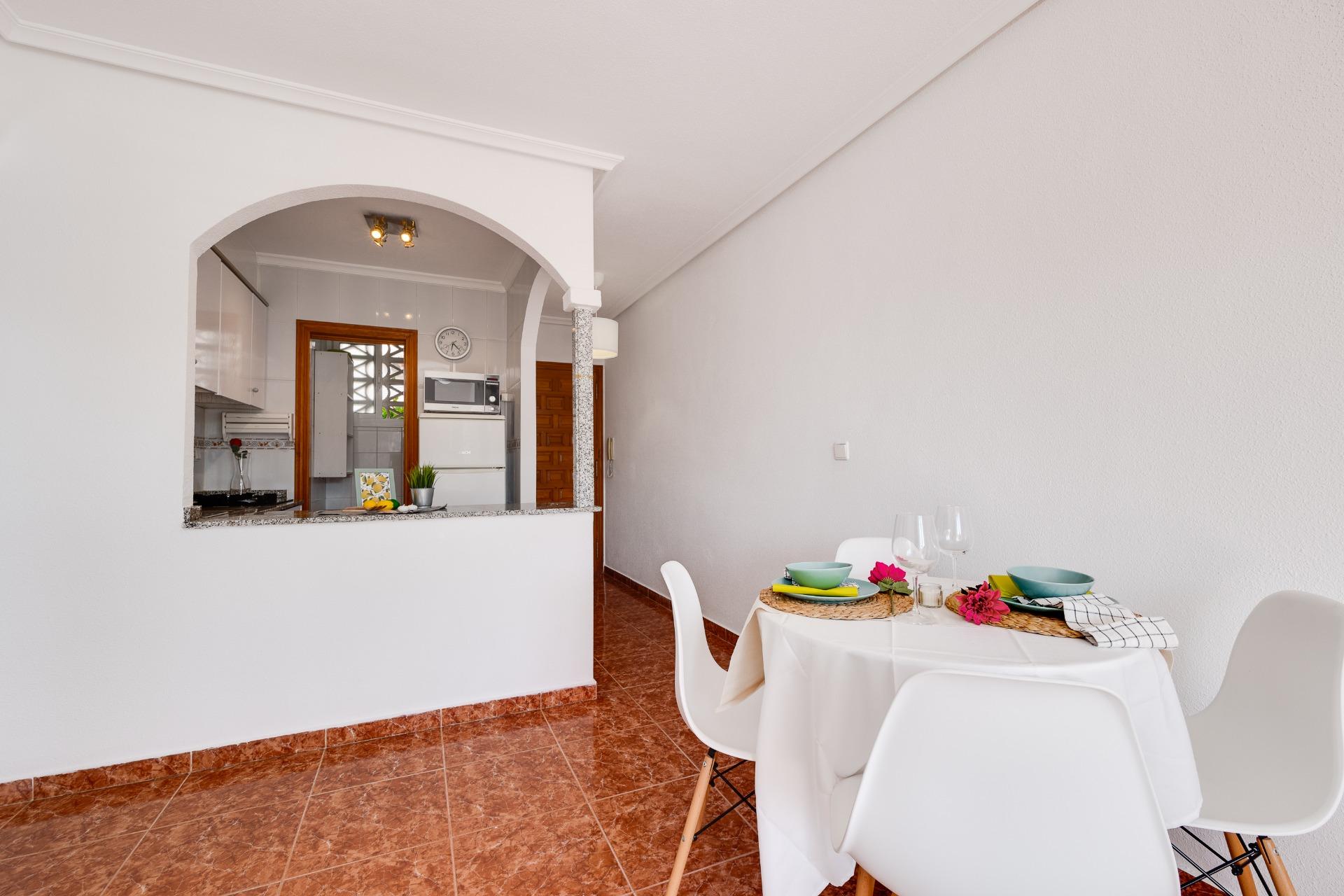 Poolside terrace and seating at residential complex, Calas Blanca, Torrevieja