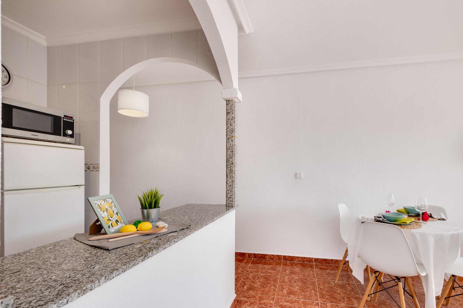 Gated entrance and communal area of complex, Calas Blanca, Torrevieja