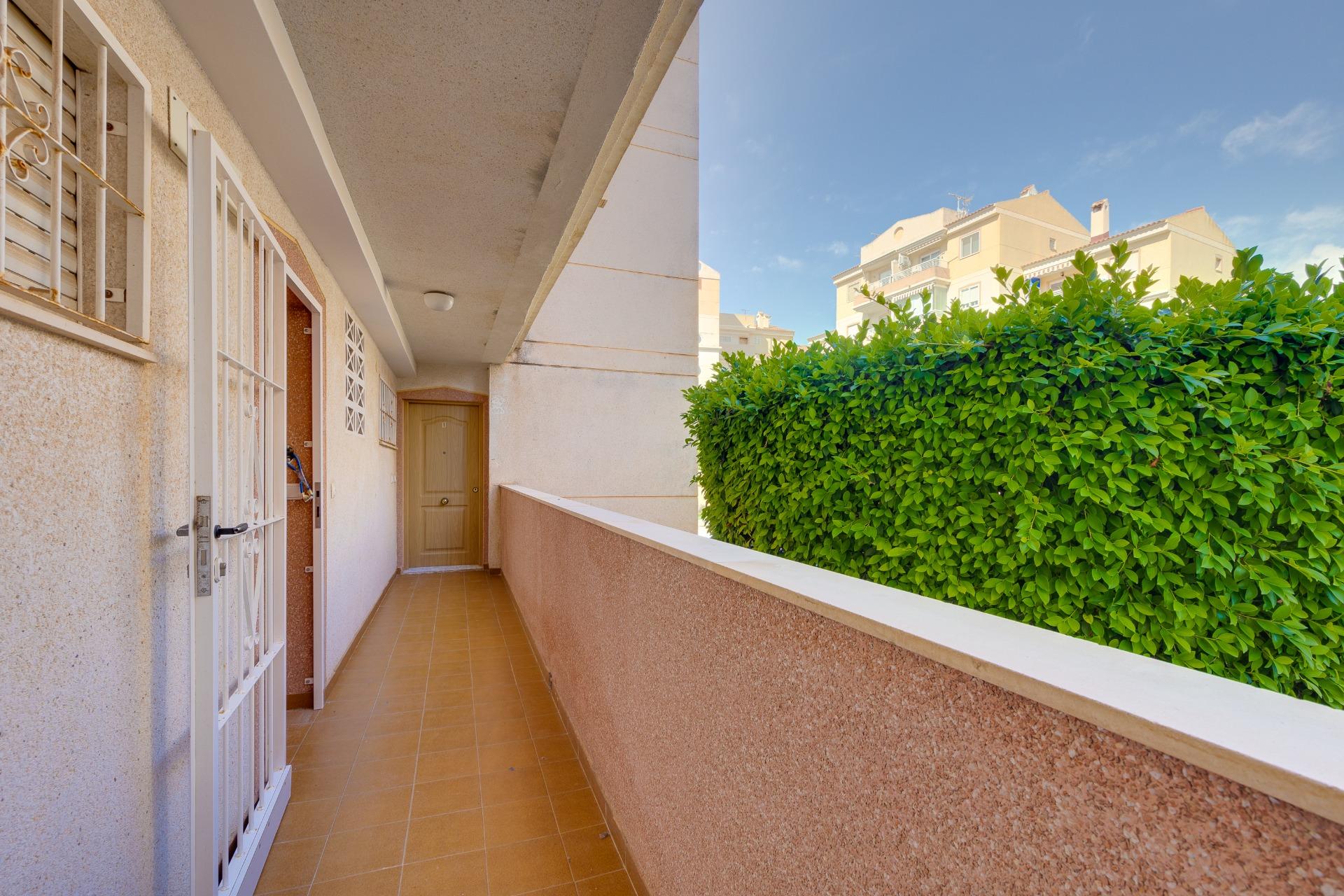 Pool area with sun terrace at gated complex, Calas Blanca, Torrevieja