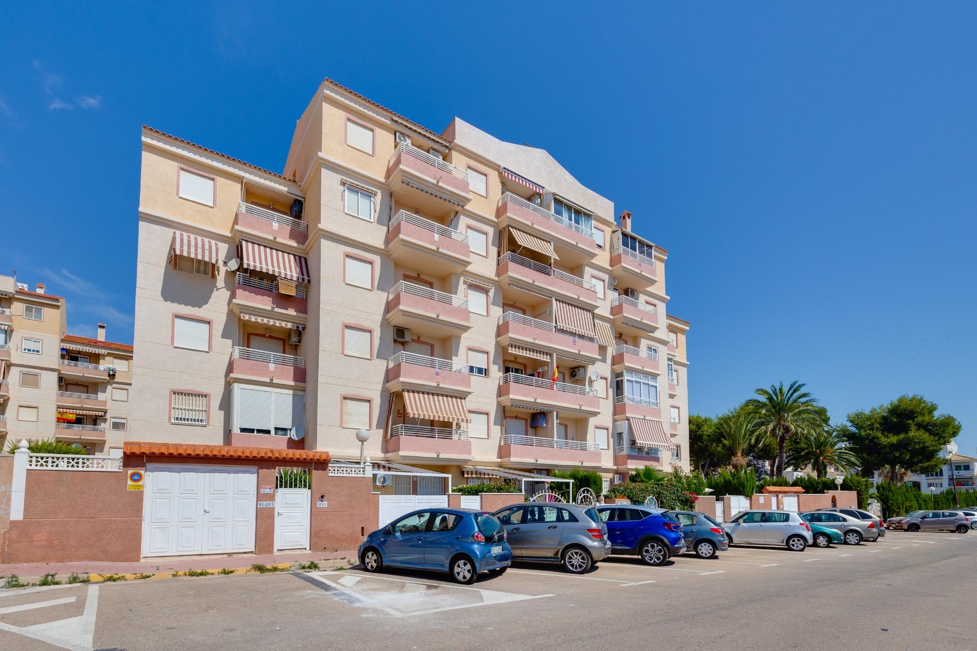 Bedroom with fitted storage in Calas Blanca apartment, Torrevieja