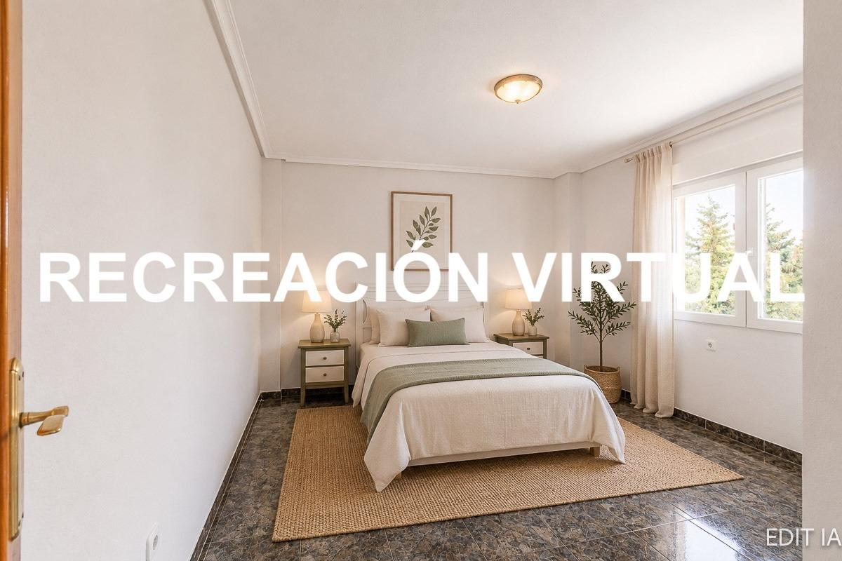 Side elevation of townhouse with enclosed garden, Playa Flamenca