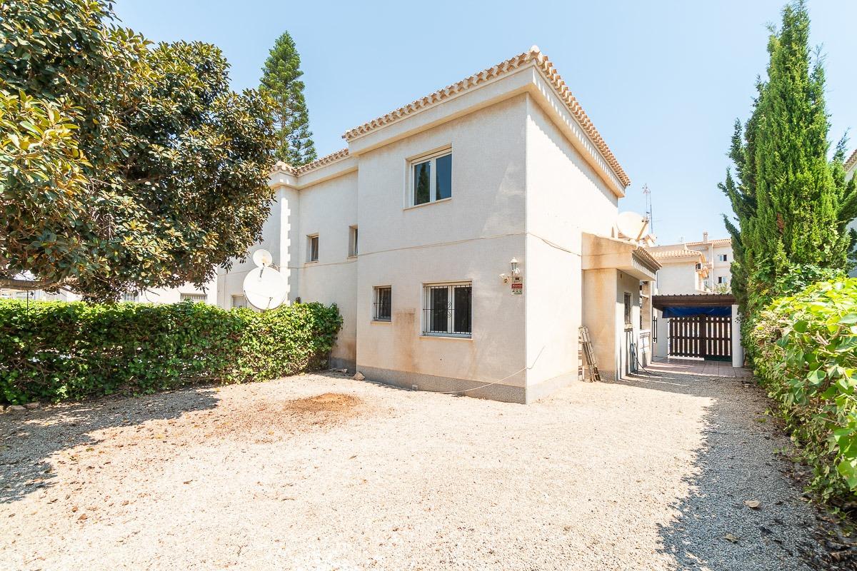 Open-plan kitchen with pantry access in Playa Flamenca townhouse