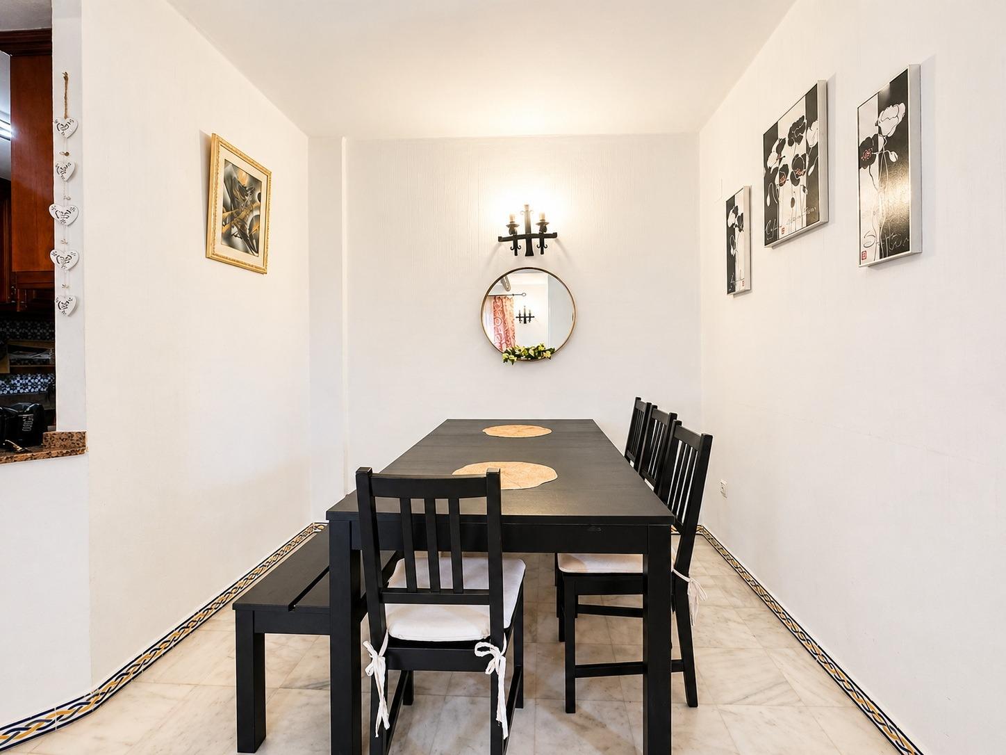 Open-plan dining and living area with table and chairs in apartment, Los Frutales, Torrevieja