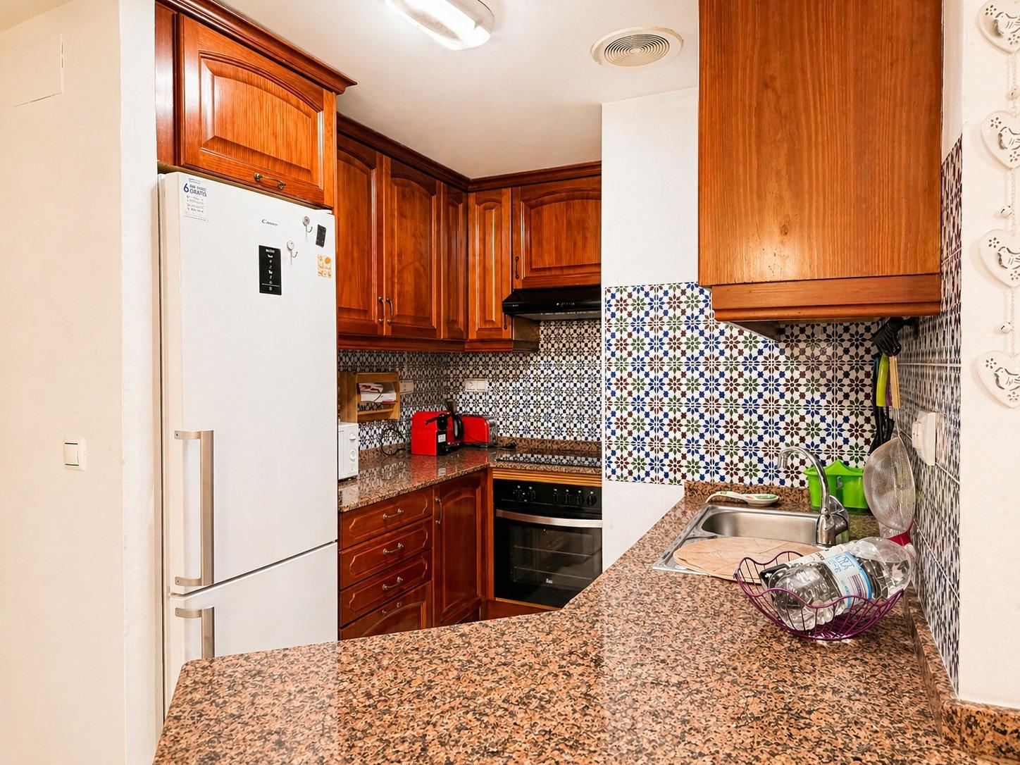 Kitchen worktop and wall-mounted storage units in apartment, Los Frutales, Torrevieja