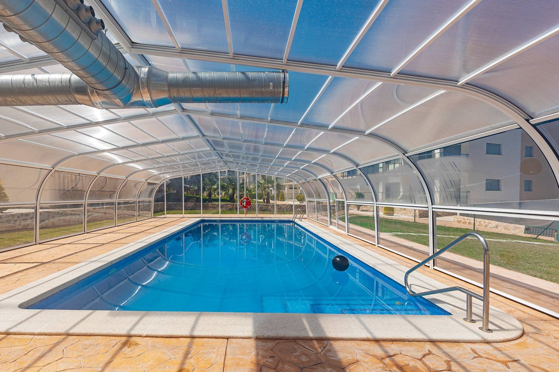 Communal pool sun terrace with lounger area, Los Dolses complex