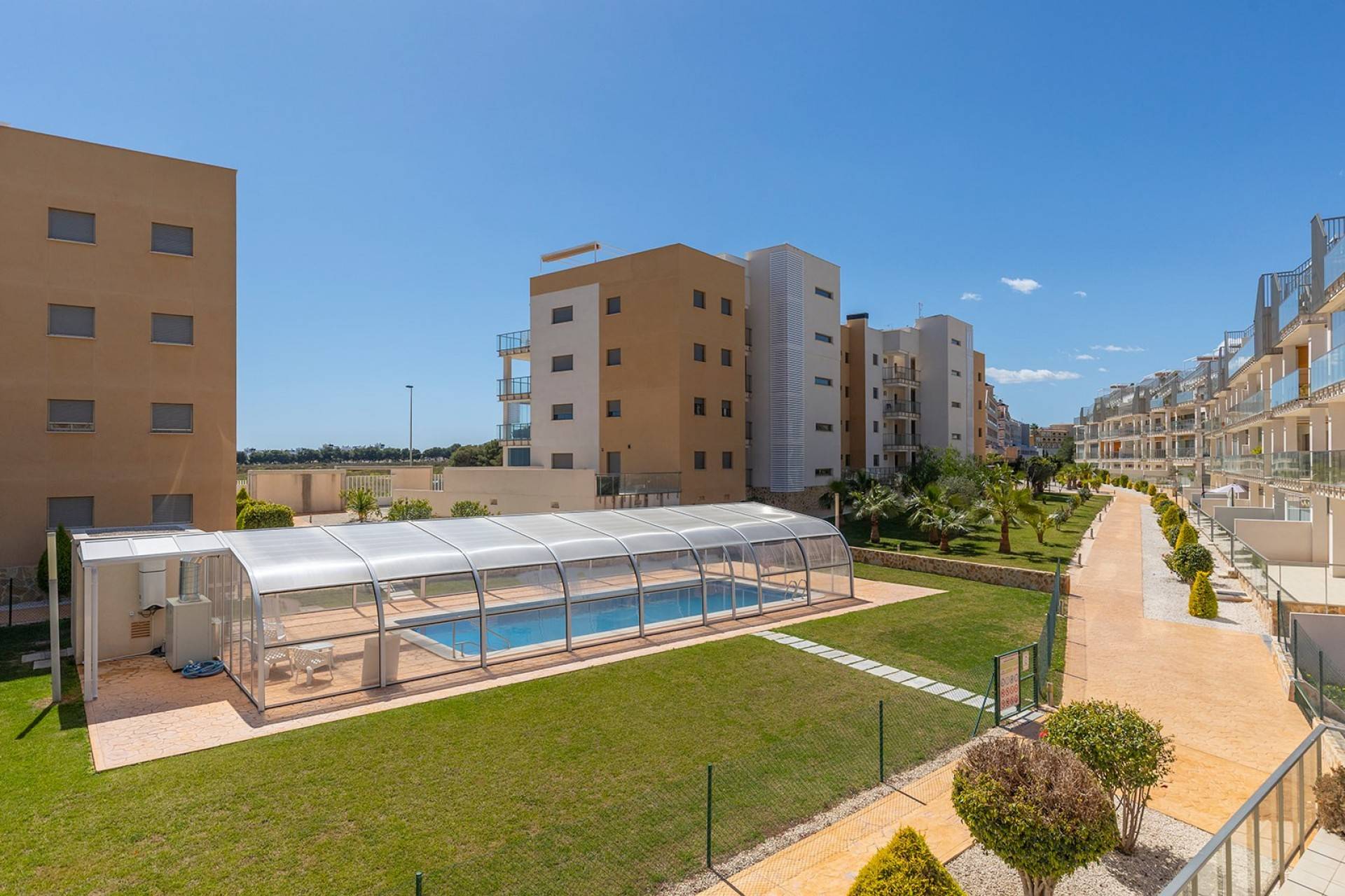 Street-level view of apartment block exterior, Los Dolses, Orihuela Costa