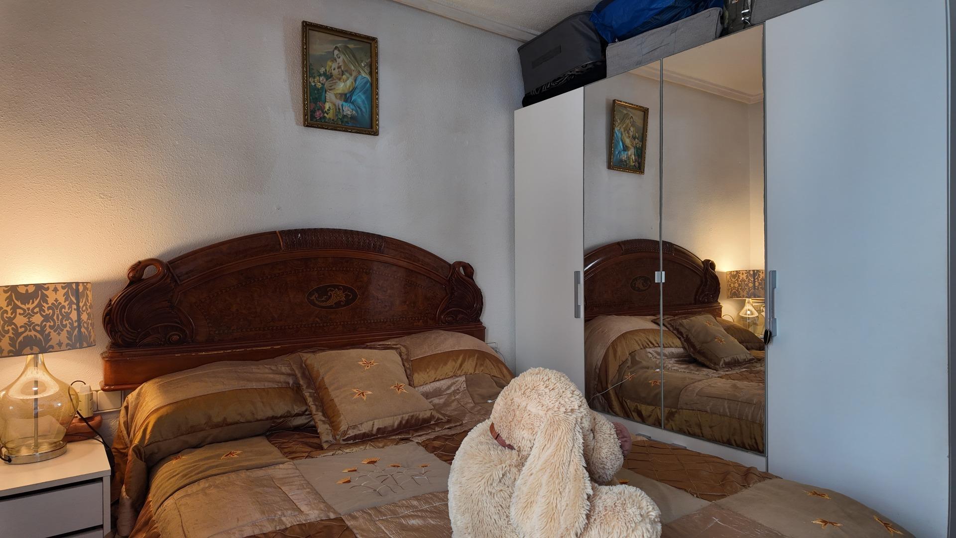 Communal pool with surrounding terrace, residential building in Punta Prima, Torrevieja