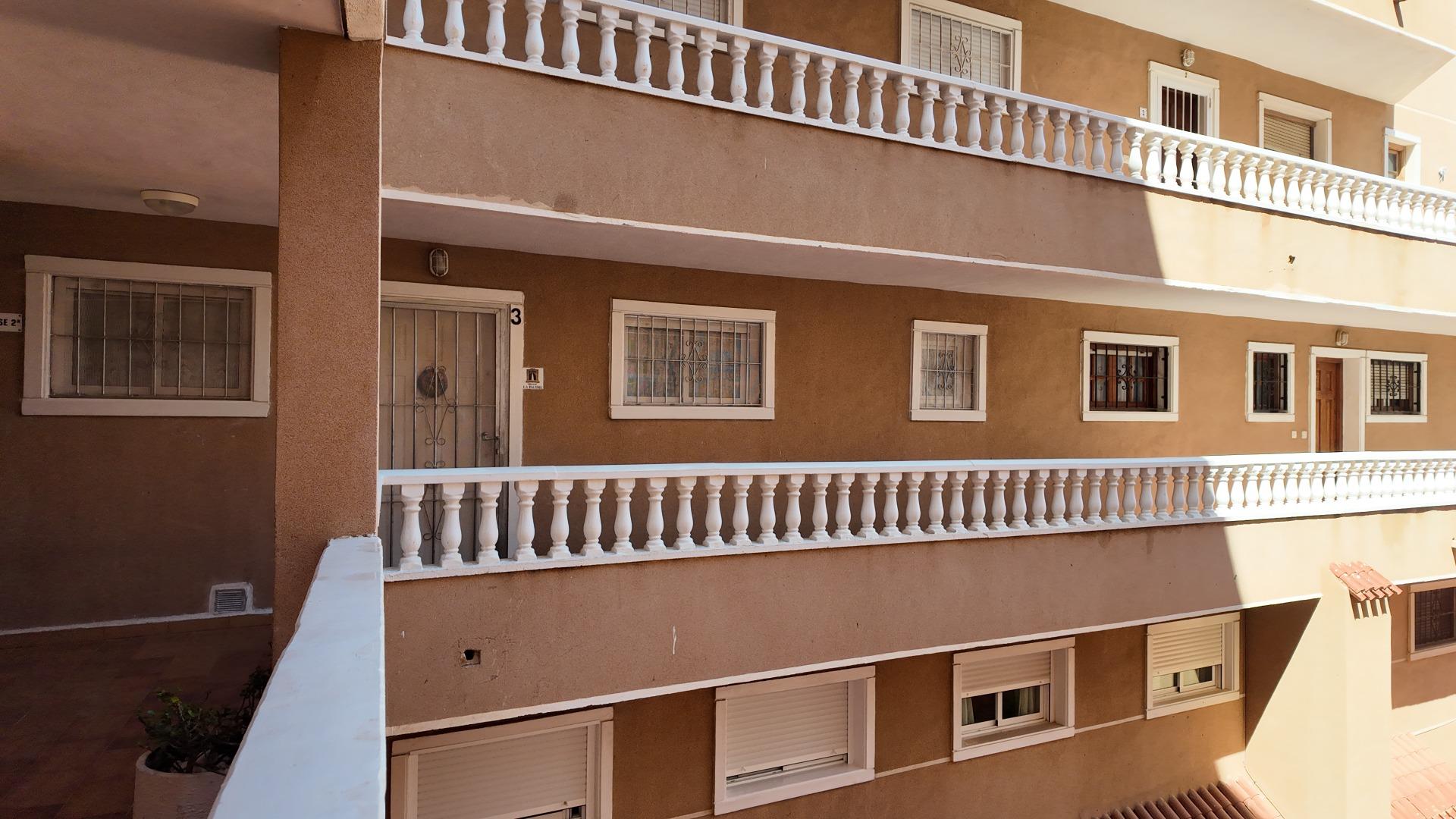 Street-facing facade of apartment building in Punta Prima, Torrevieja