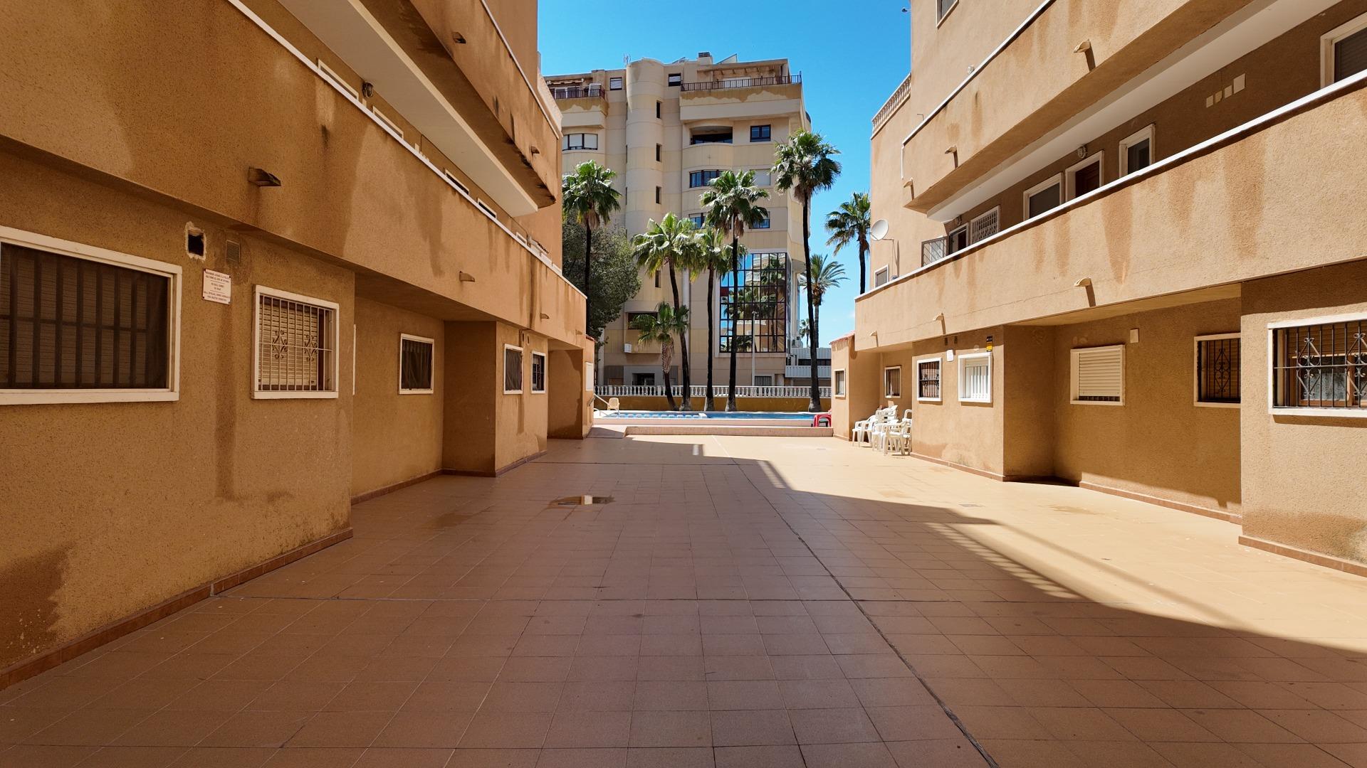 Street and neighbouring buildings in Punta Prima, Torrevieja