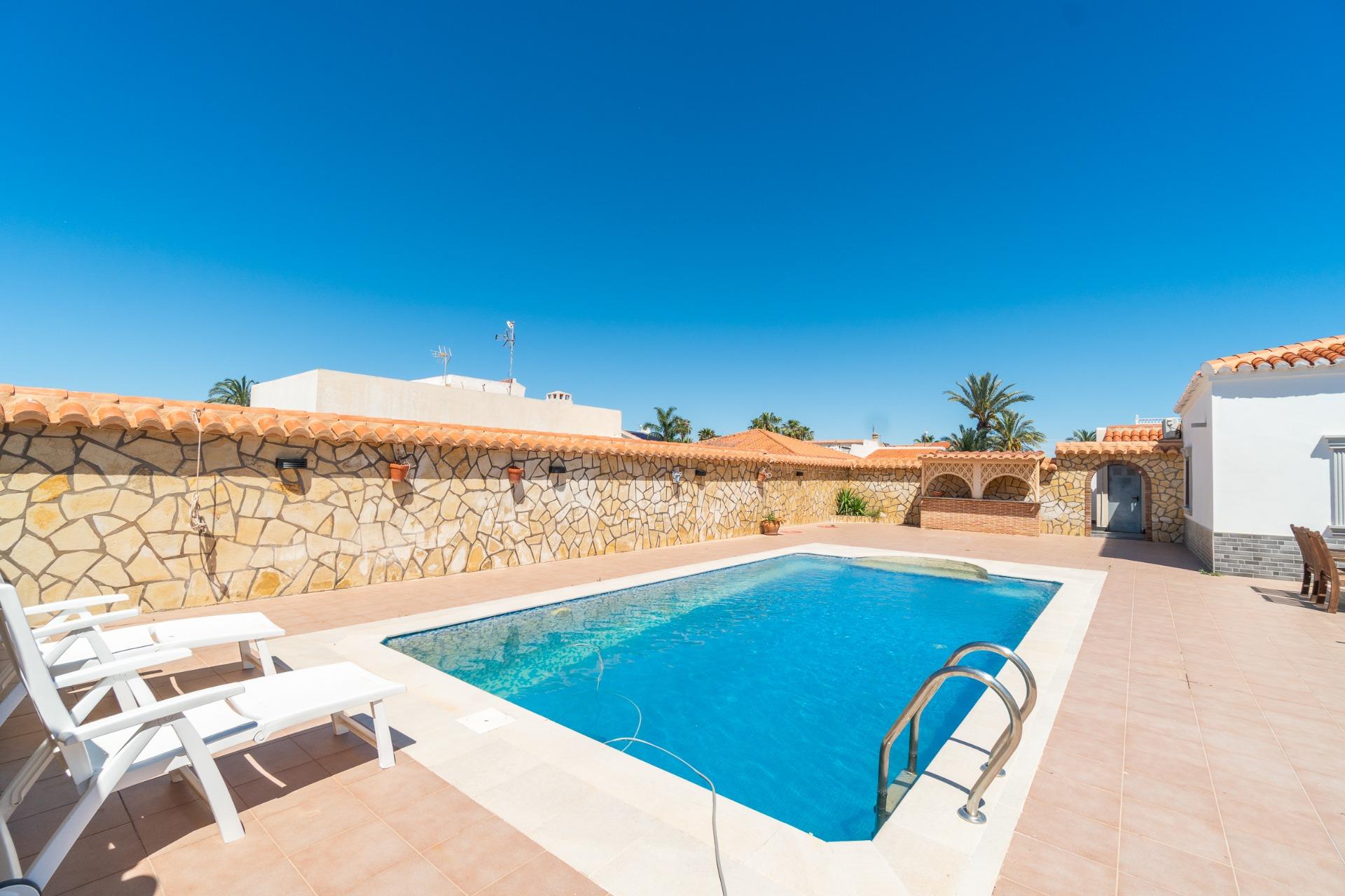 Pool viewed from garden level with paving surround, Torreta Florida villa