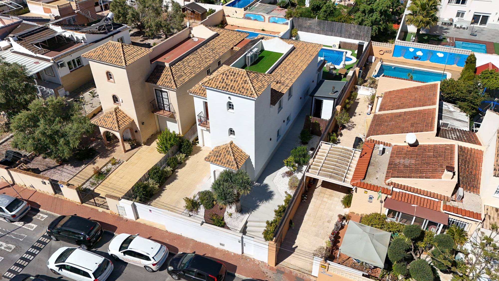 Rear garden with private heated swimming pool and paved chill-out terrace, La Siesta villa
