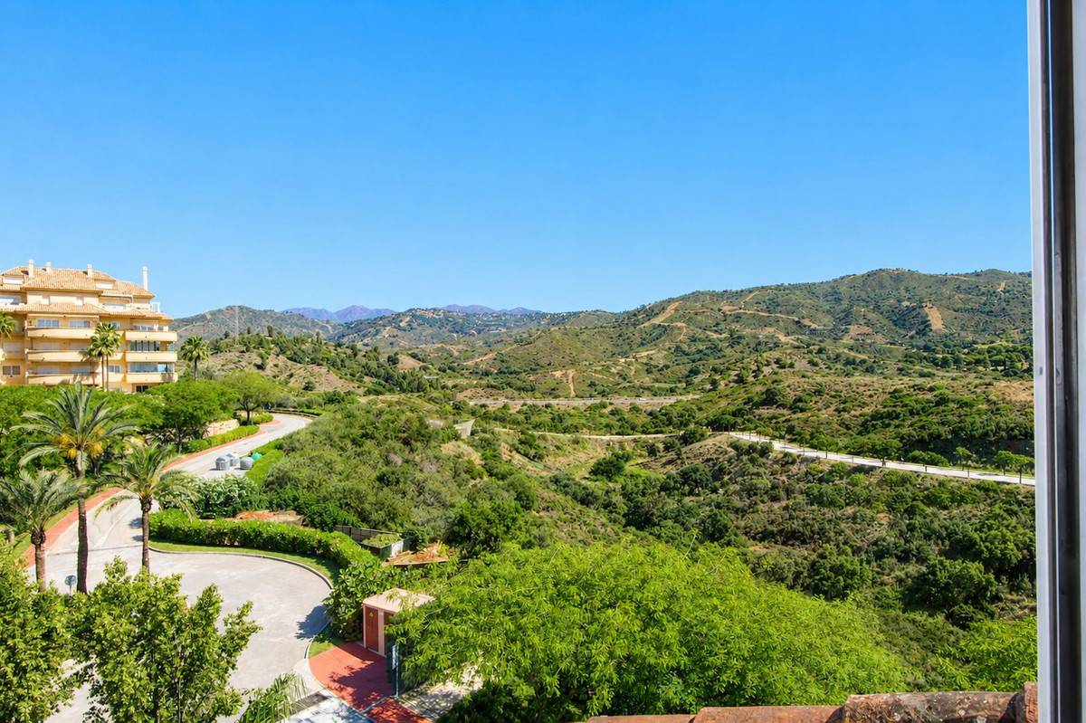 Master bedroom with coastal views on upper floor of corner penthouse, Elviria Hills