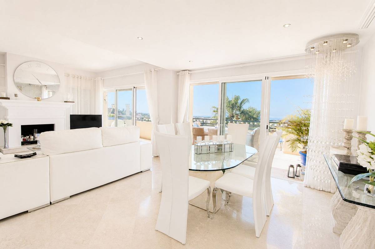 Living room with large windows and direct terrace access, corner penthouse, Elviria Hills