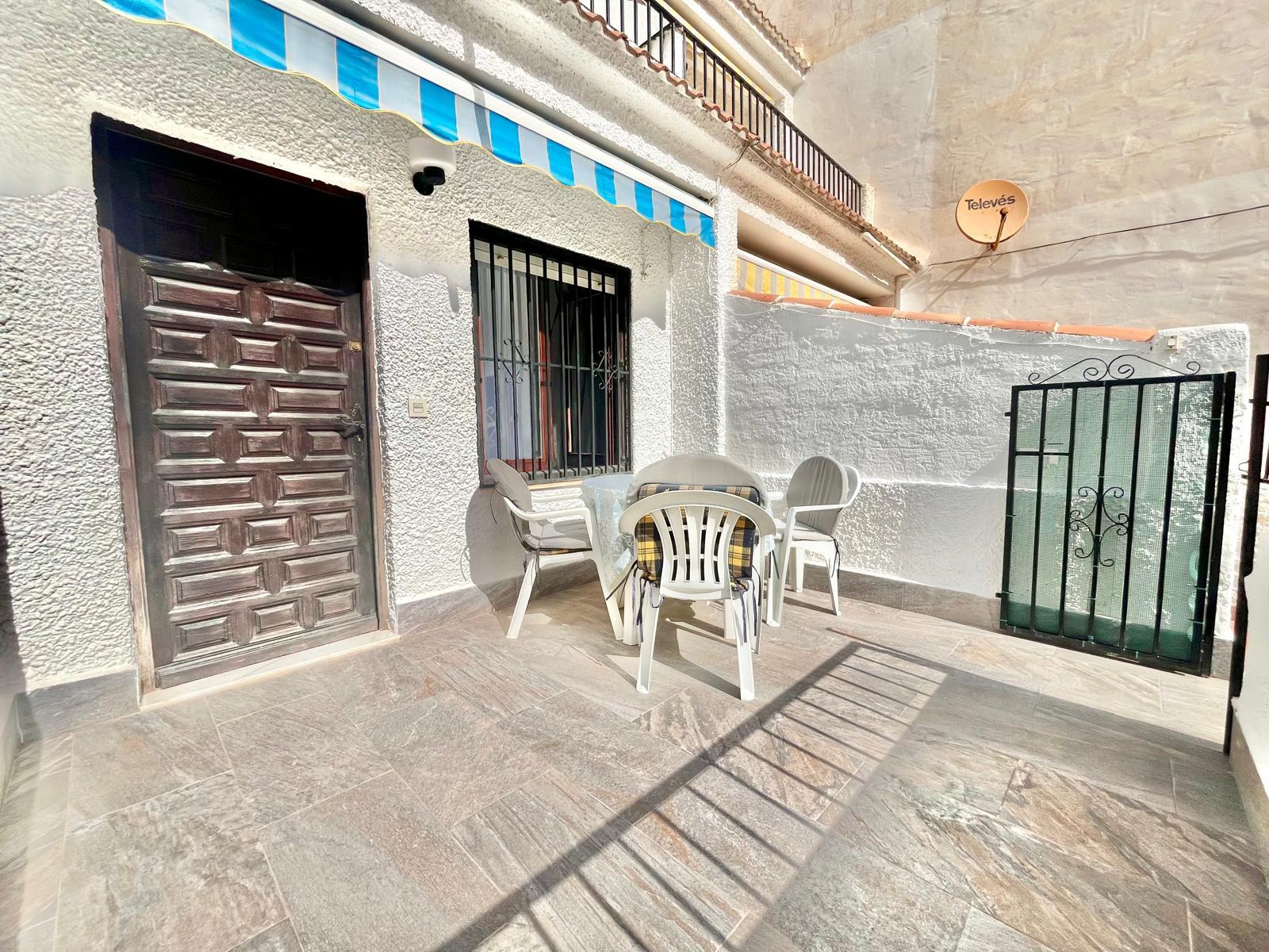 Open-plan living room with east-facing windows in 2-bedroom duplex penthouse, Playa de los Locos