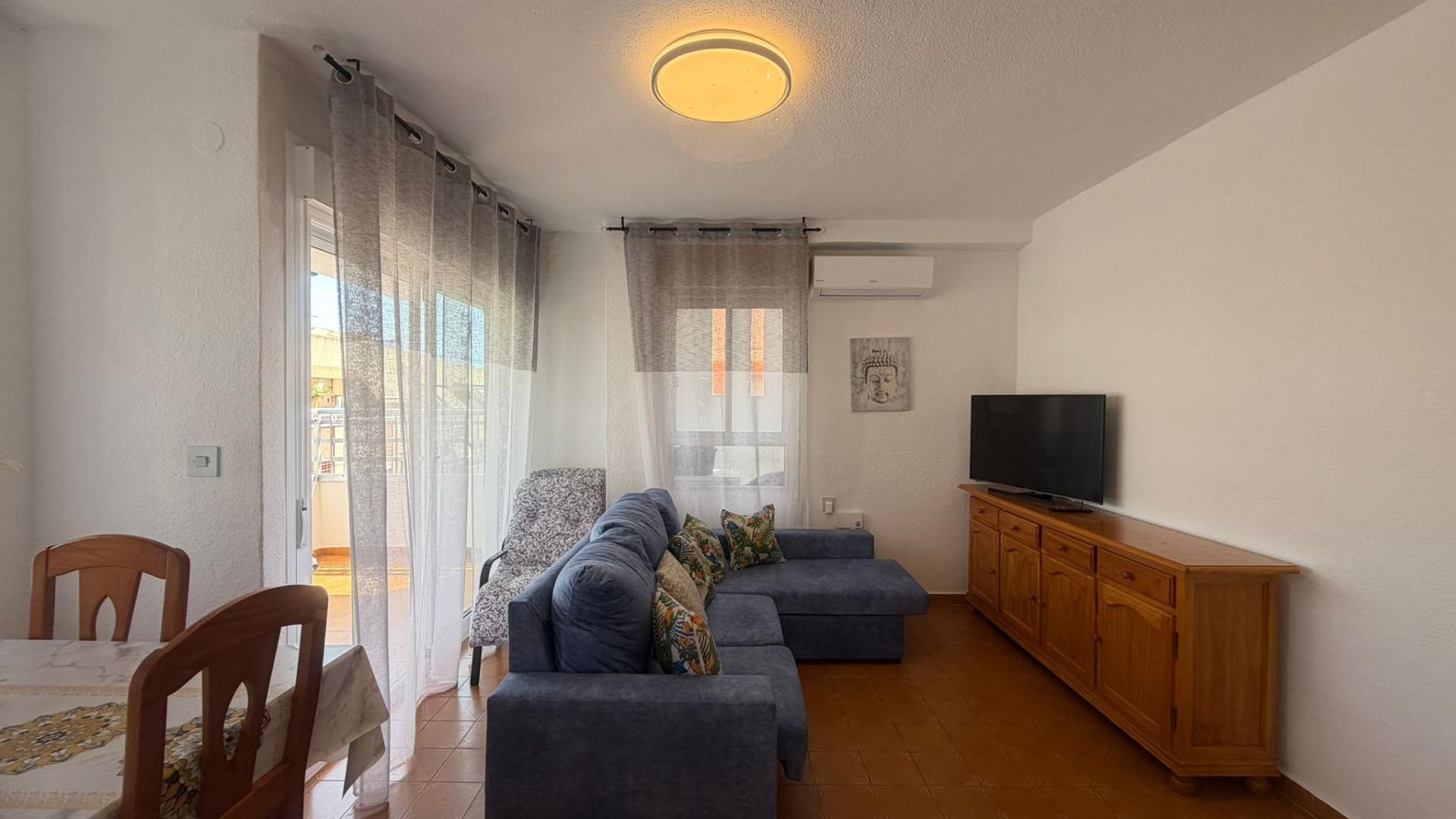 Living and dining room towards terrace doors in penthouse, Playa de los Locos, Torrevieja