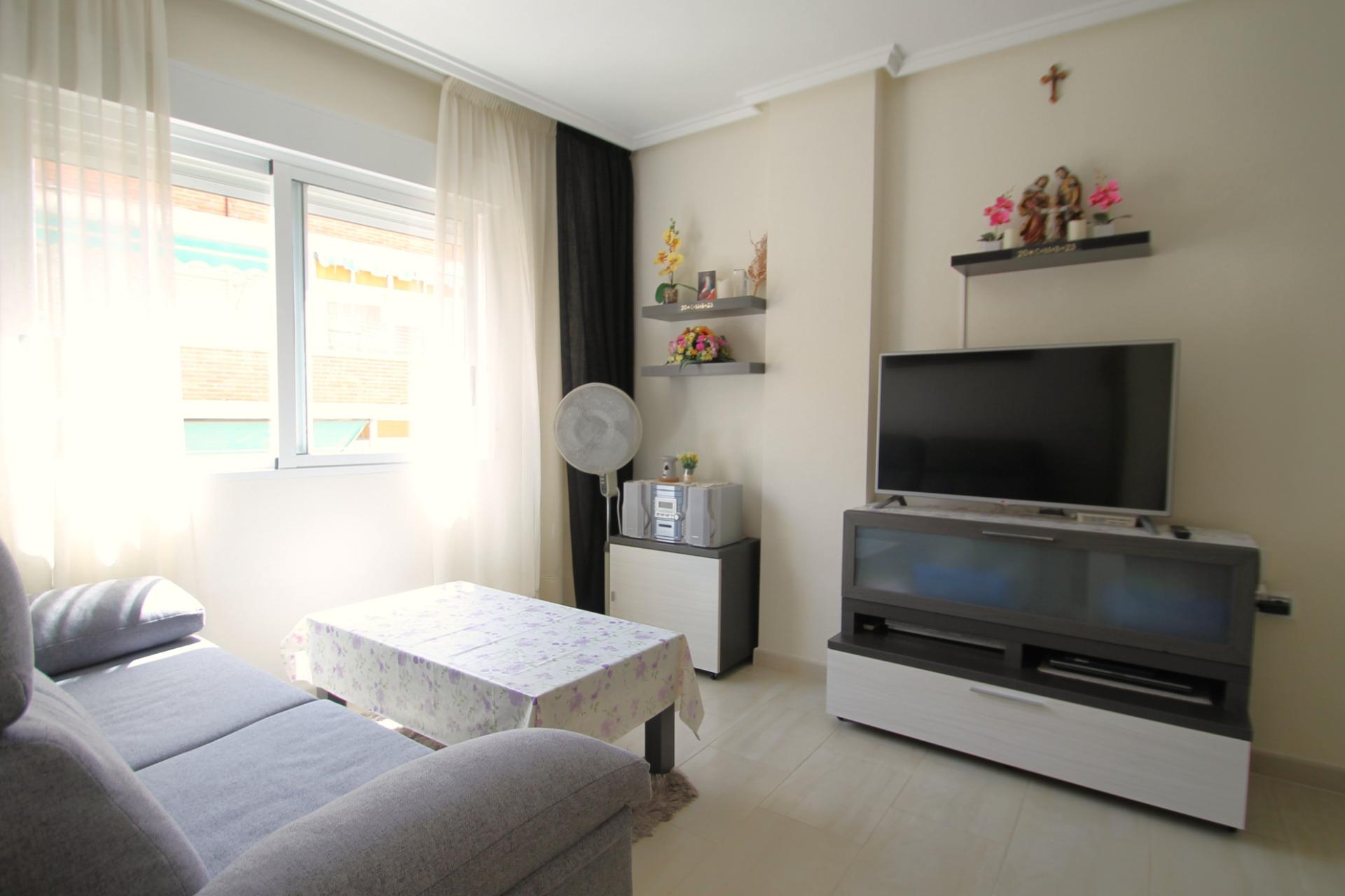 Living area with east-facing windows in 2-bedroom apartment, El Molino, Torrevieja