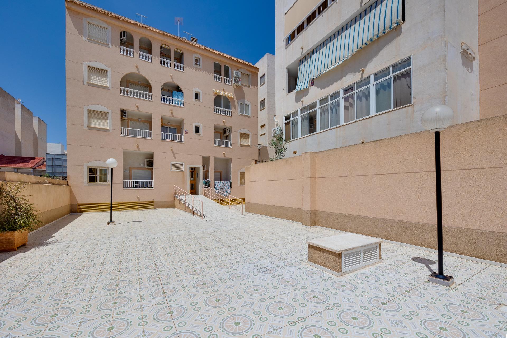 Exterior facade of 3-storey residential building, El Molino, Torrevieja