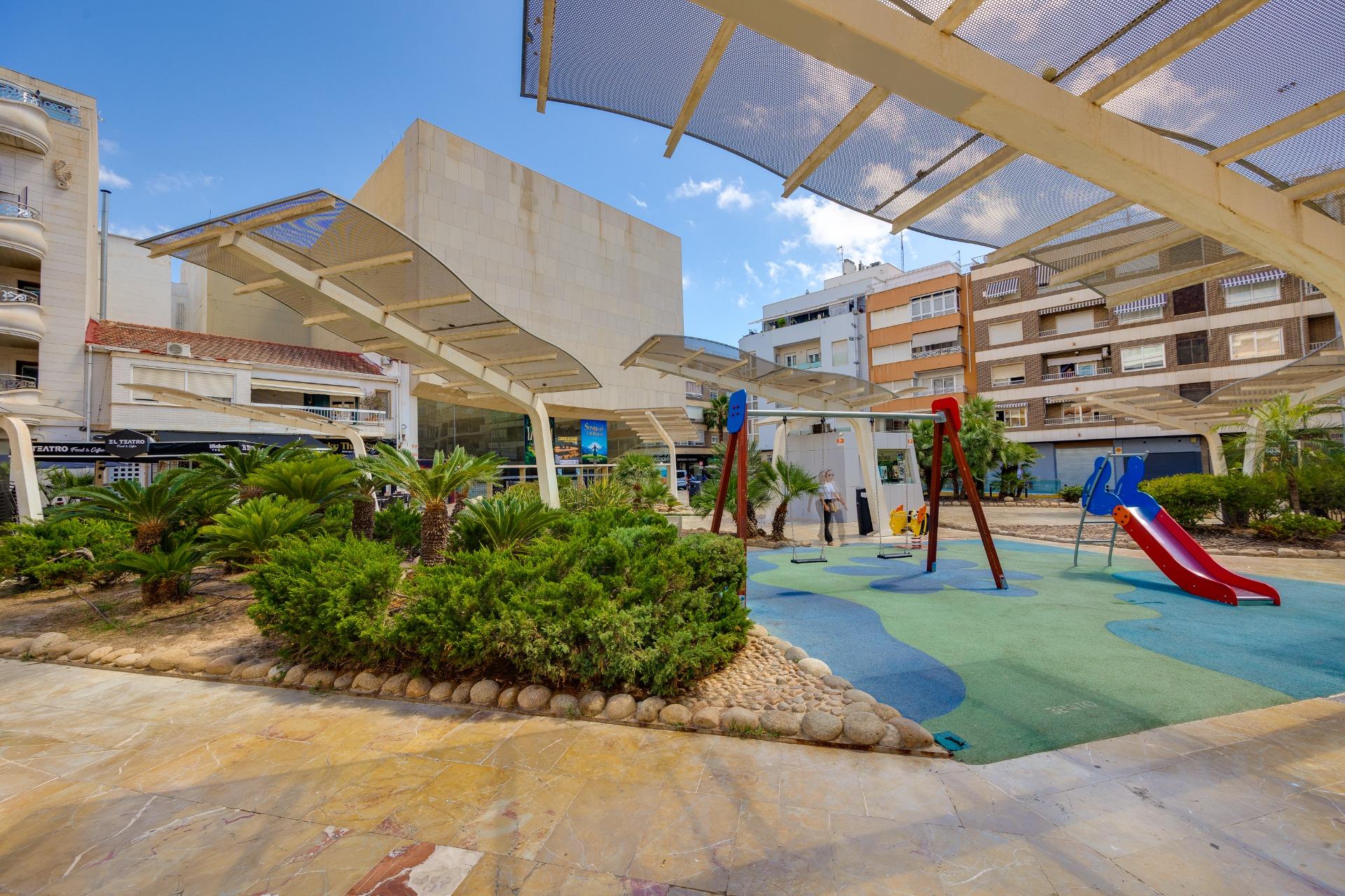 Parking area and building exterior at residential complex, El Molino, Torrevieja
