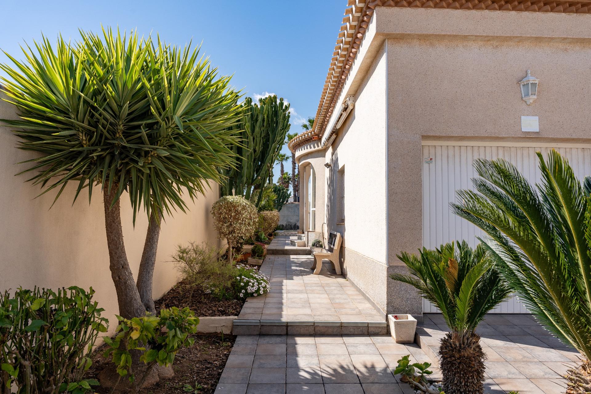 Private garage interior with automatic access gates, detached villa, Playa Flamenca
