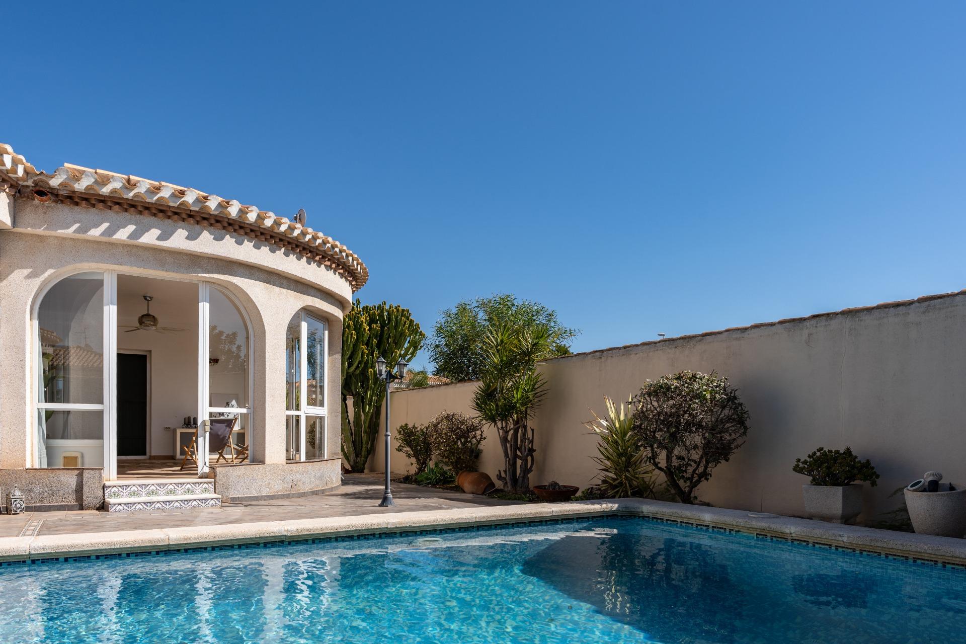 Covered arched terrace at front entrance of villa, Playa Flamenca, Orihuela Costa
