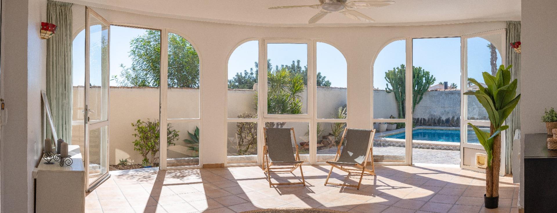 Built-in barbecue and wooden pergola on terrace, detached villa in Playa Flamenca