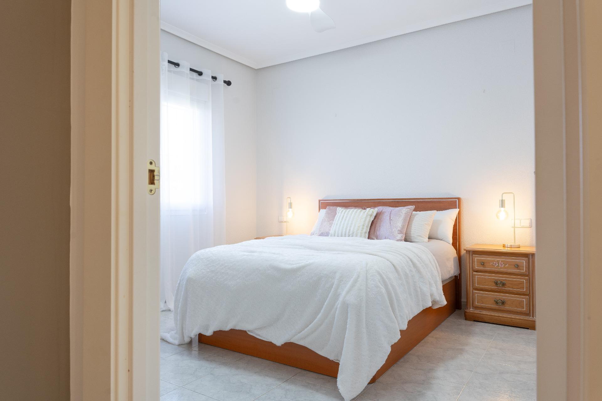 Bedroom with window overlooking garden, 3-bedroom villa, Playa Flamenca