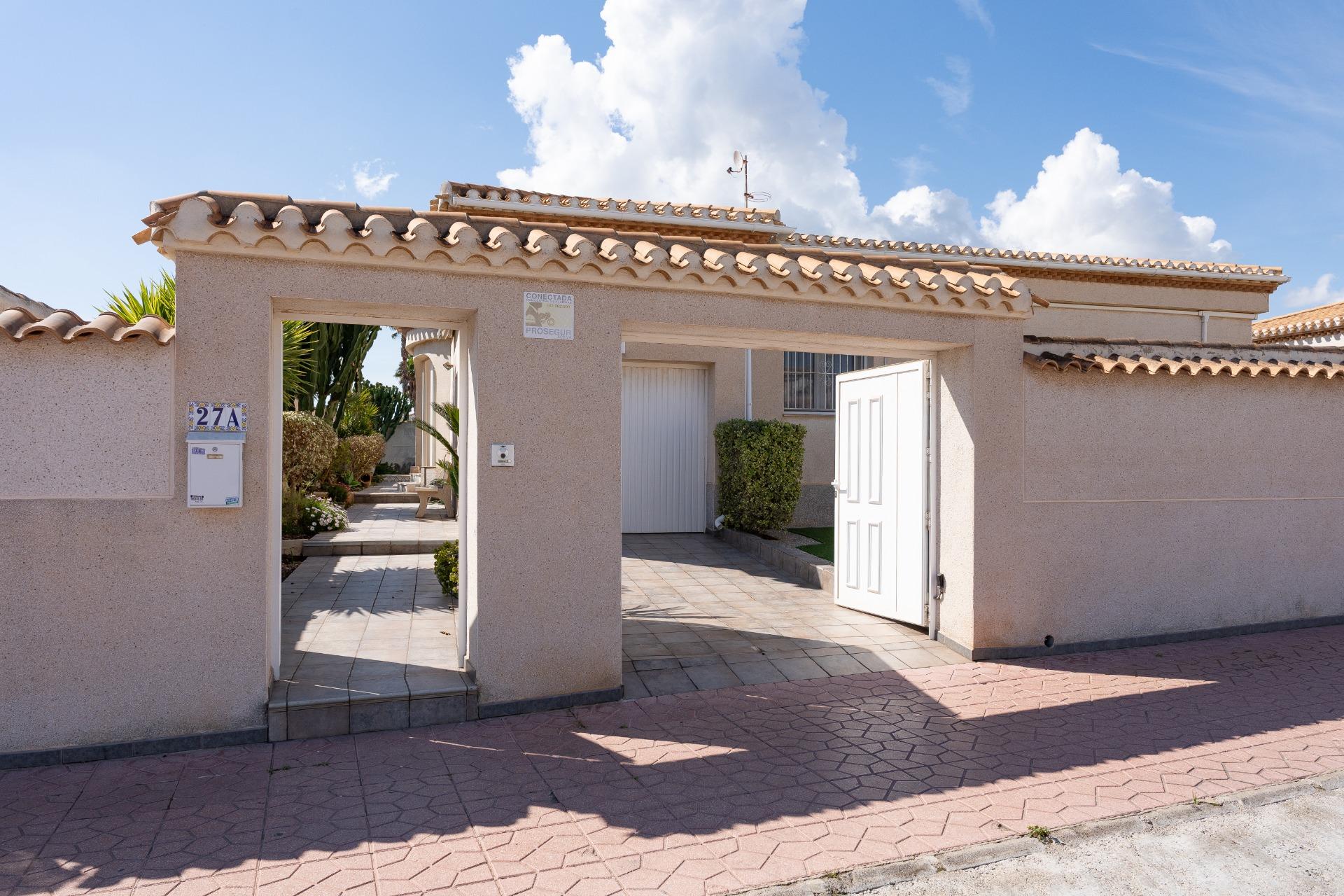 Living room with electric fireplace, 3-bedroom single-storey villa, Playa Flamenca