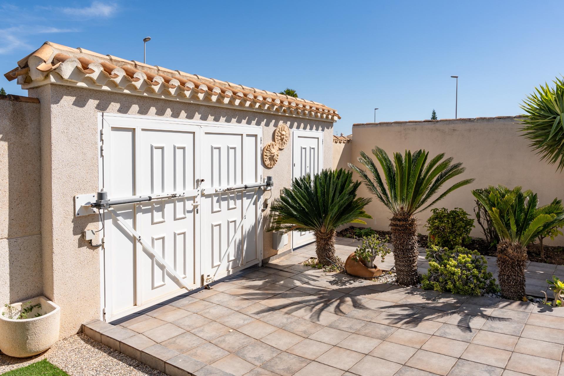 Plot boundary wall and garden surrounds, single-storey villa, Playa Flamenca