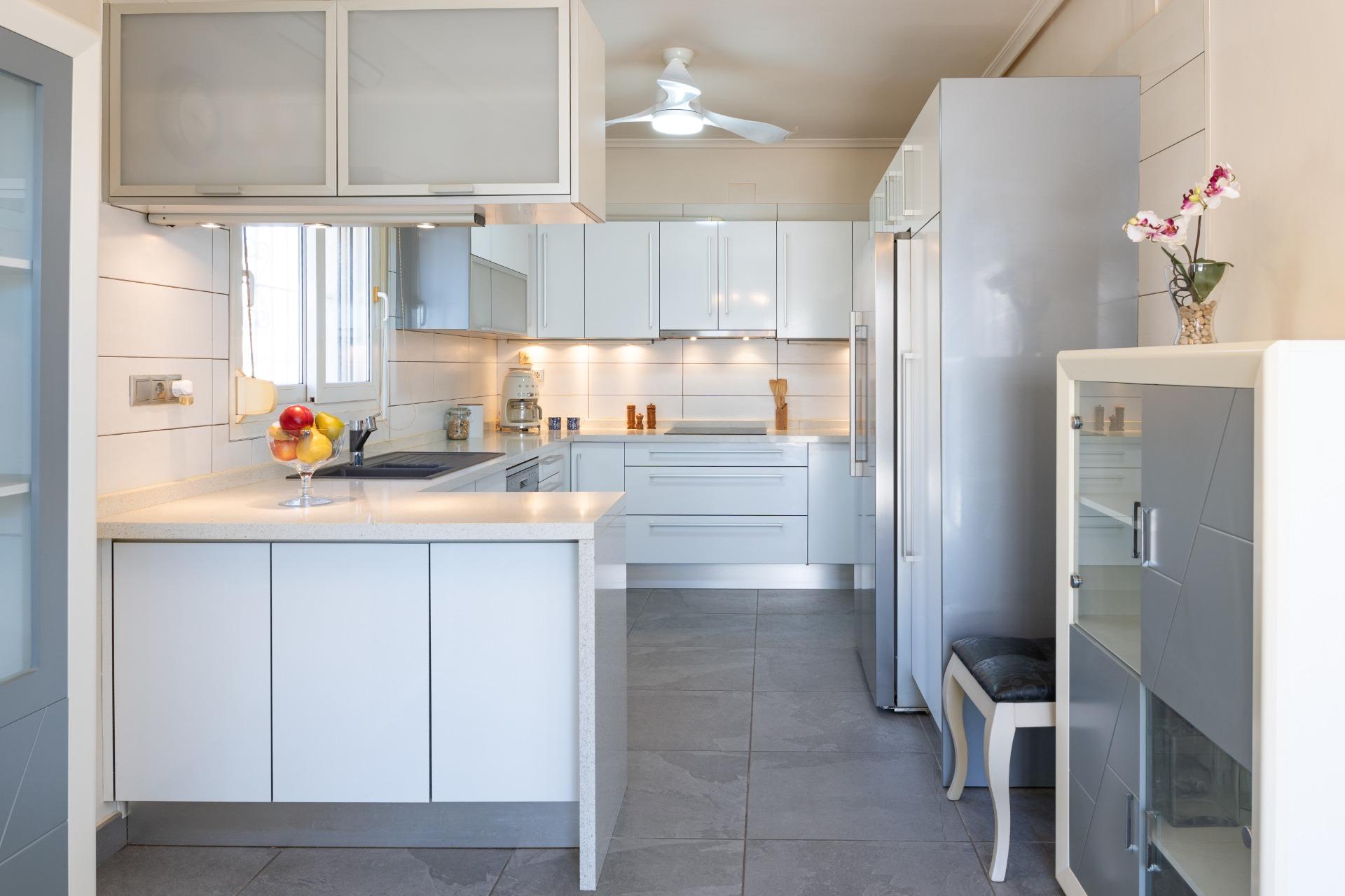 Kitchen-dining area with patio doors opening to pool terrace, Playa Flamenca villa