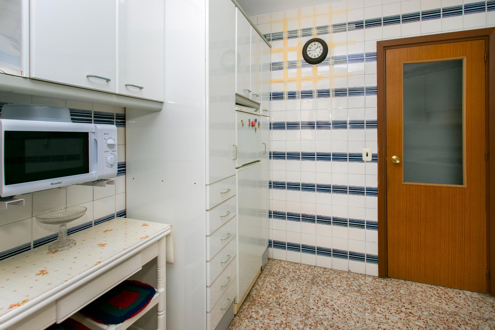 Kitchen detail showing fitted cabinetry in penthouse, Playa del Cura, Torrevieja