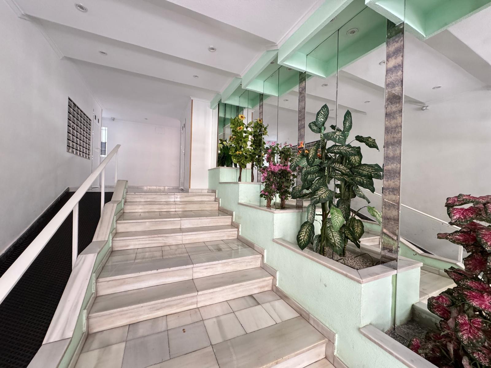 Living room interior with natural light through window, 2-bedroom apartment, Playa del Cura