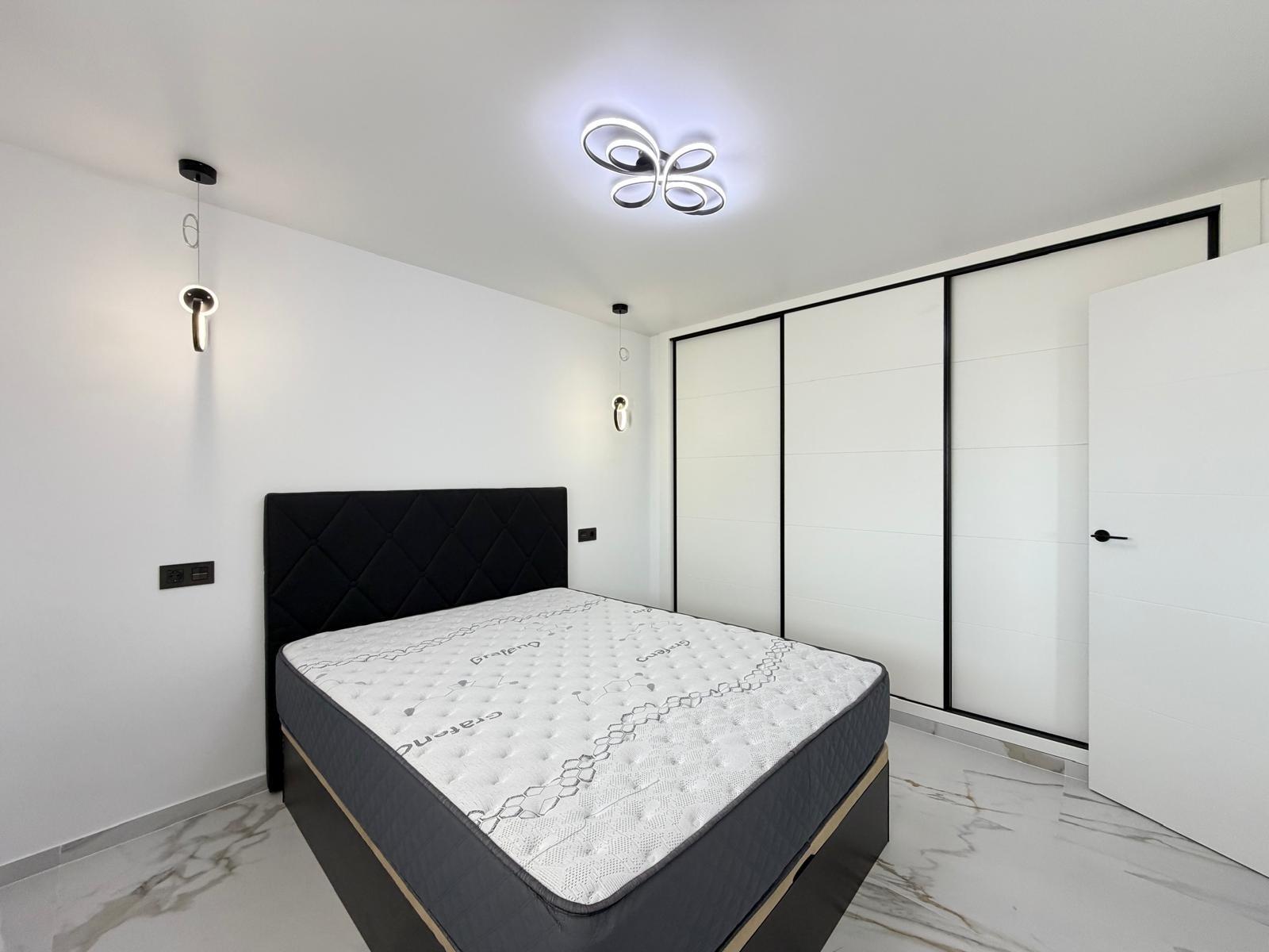 Terrace railing and tiled outdoor area of 4th-floor apartment, La Zenia