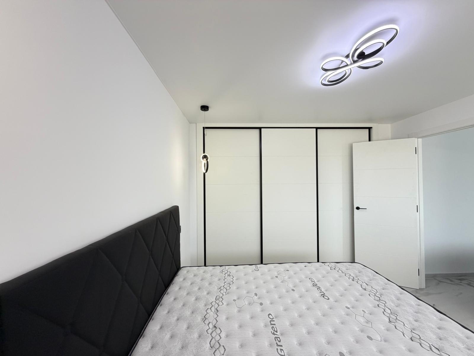 Bathroom vanity and mirror in renovated 1-bedroom apartment, La Zenia