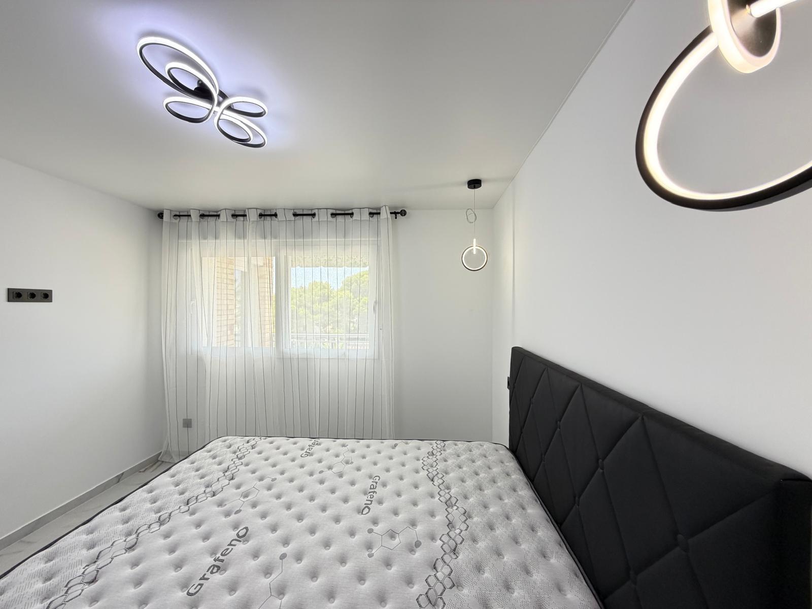 Built-in wardrobe interior in bedroom of La Zenia apartment