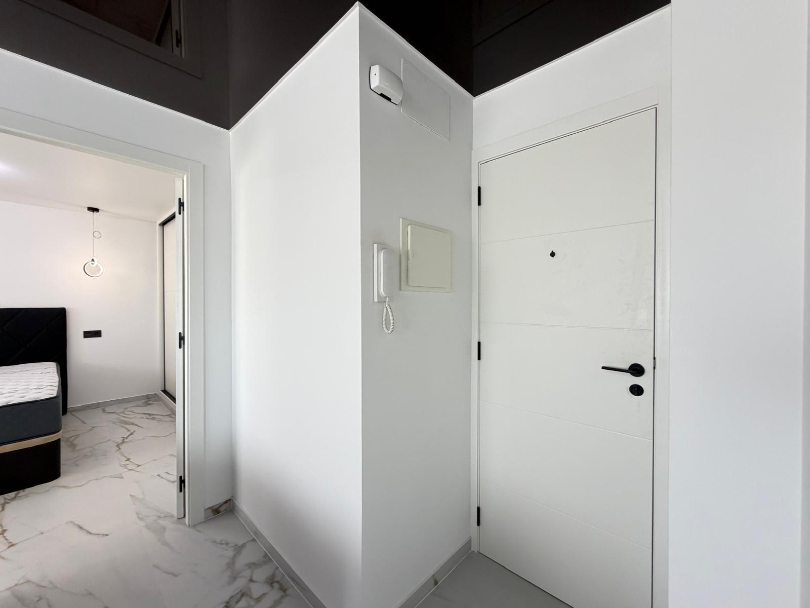 Open-plan kitchen with new units in 1-bedroom apartment, La Zenia
