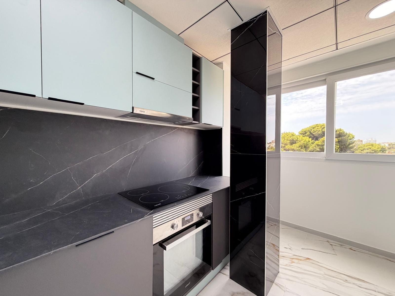 Kitchen cabinetry detail in renovated apartment, La Zenia