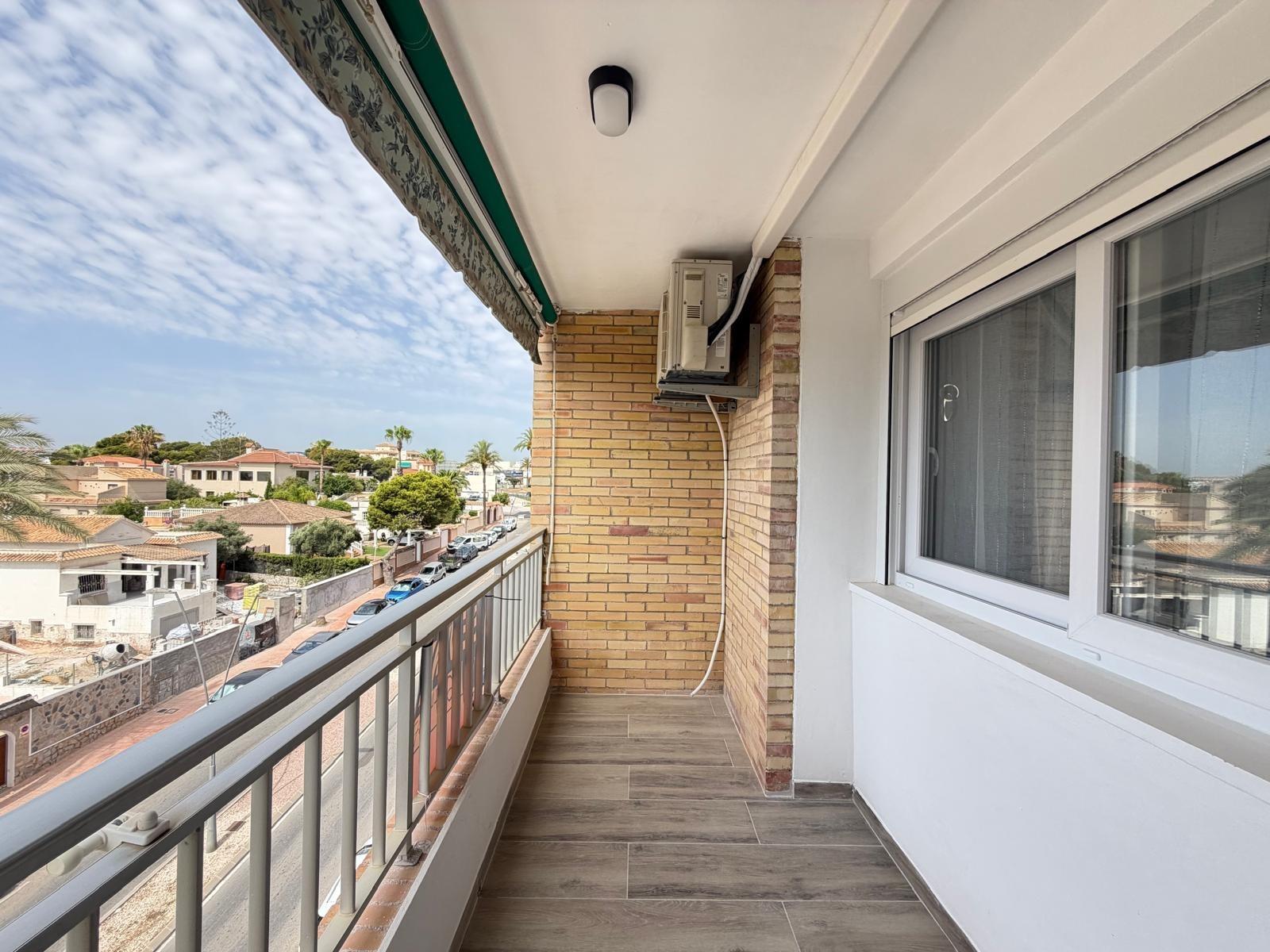 Renovated kitchen with integrated appliances in La Zenia apartment