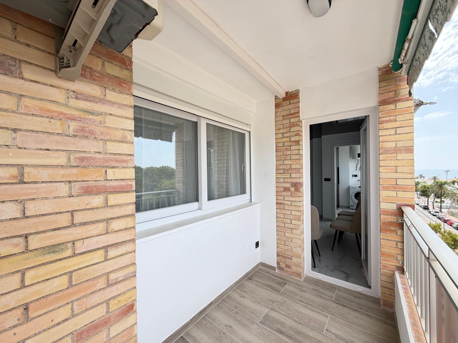 Living room corner with updated walls in La Zenia apartment