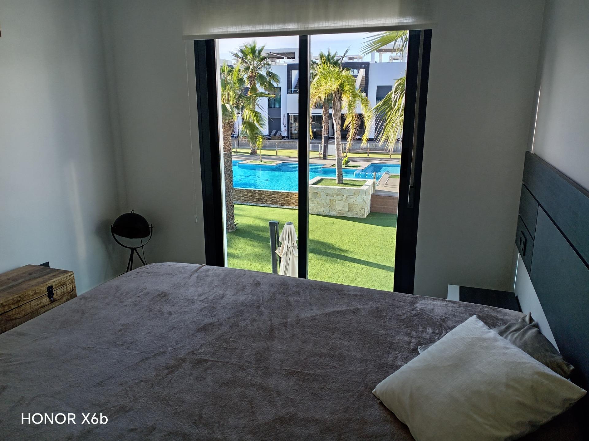 Terrace access from living room in upper-floor bungalow, El Raso, Guardamar Del Segura