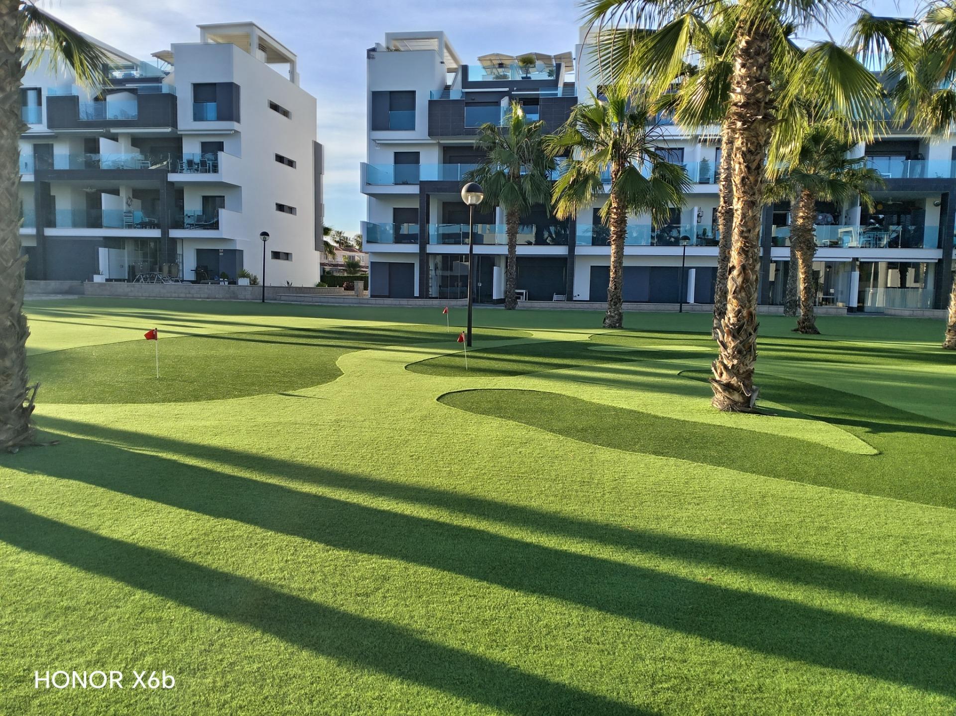 Outdoor communal space and planting at gated complex, El Raso, Guardamar Del Segura