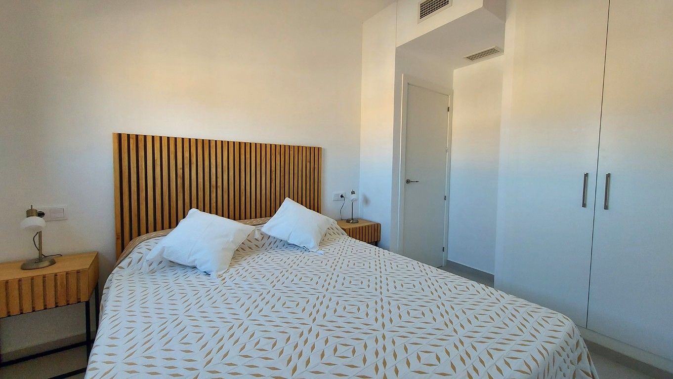 Communal pool deck with surrounding paved area, new-build development, San Miguel de Salinas