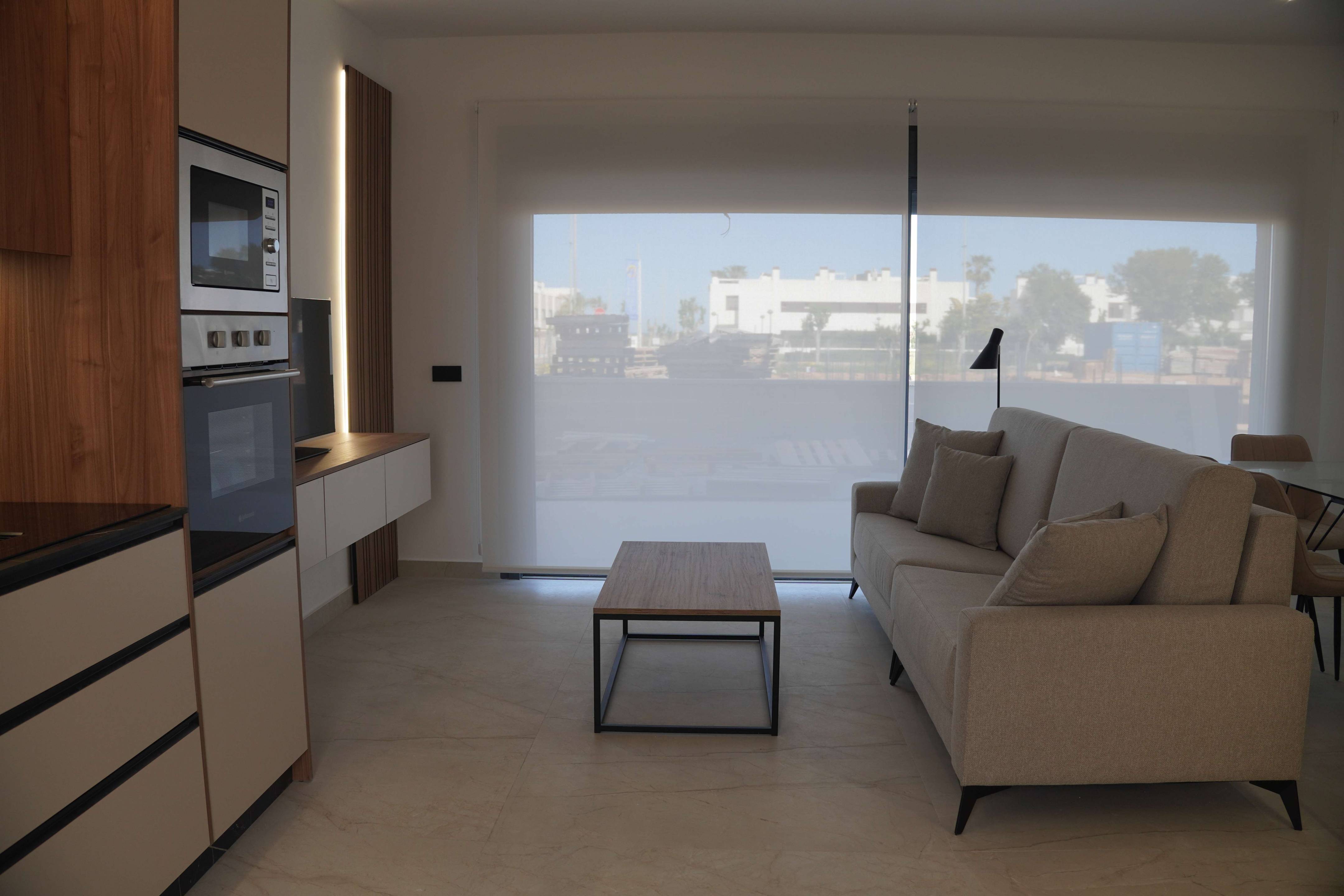 Communal pool with sun terrace and lounge chairs, La Torre de la Horadada development