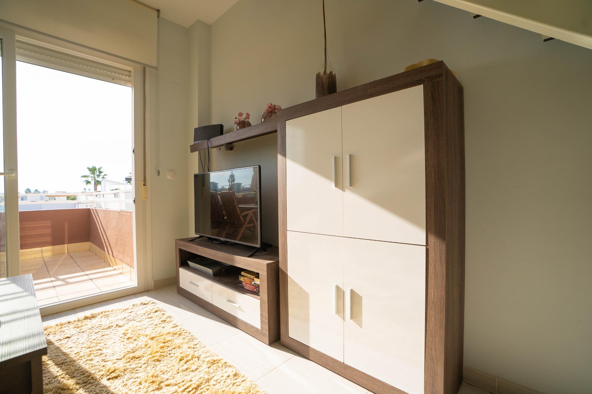 Kitchen worktop and appliances in duplex penthouse, Rocío del Mar