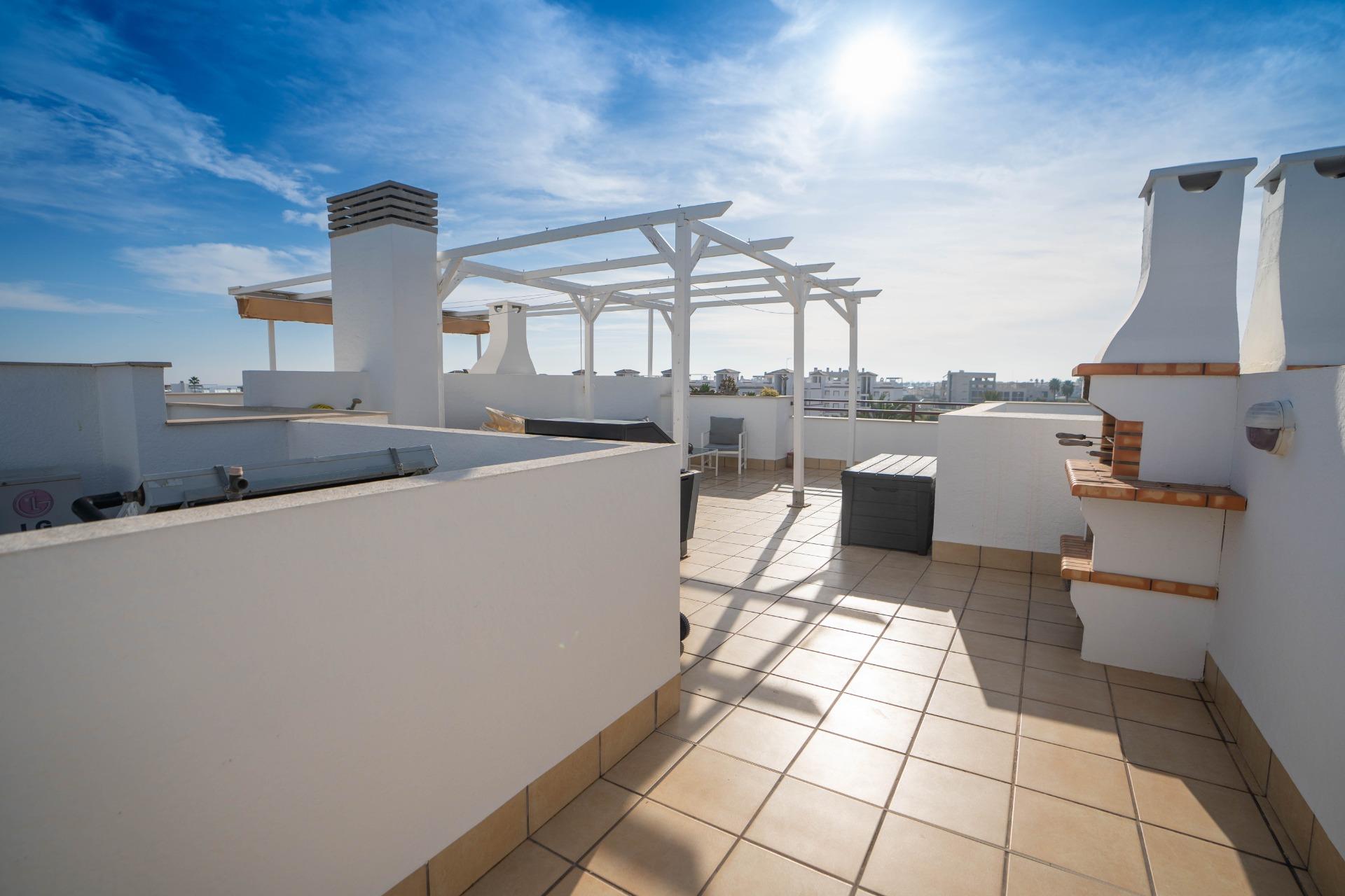 Communal garden area of penthouse complex in Rocío del Mar, Orihuela Costa