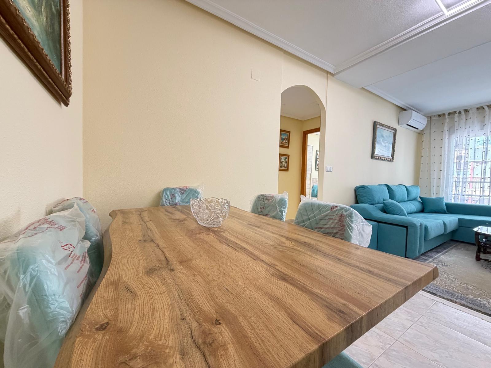 Dining table and chairs in open-plan area, Playa del Cura apartment