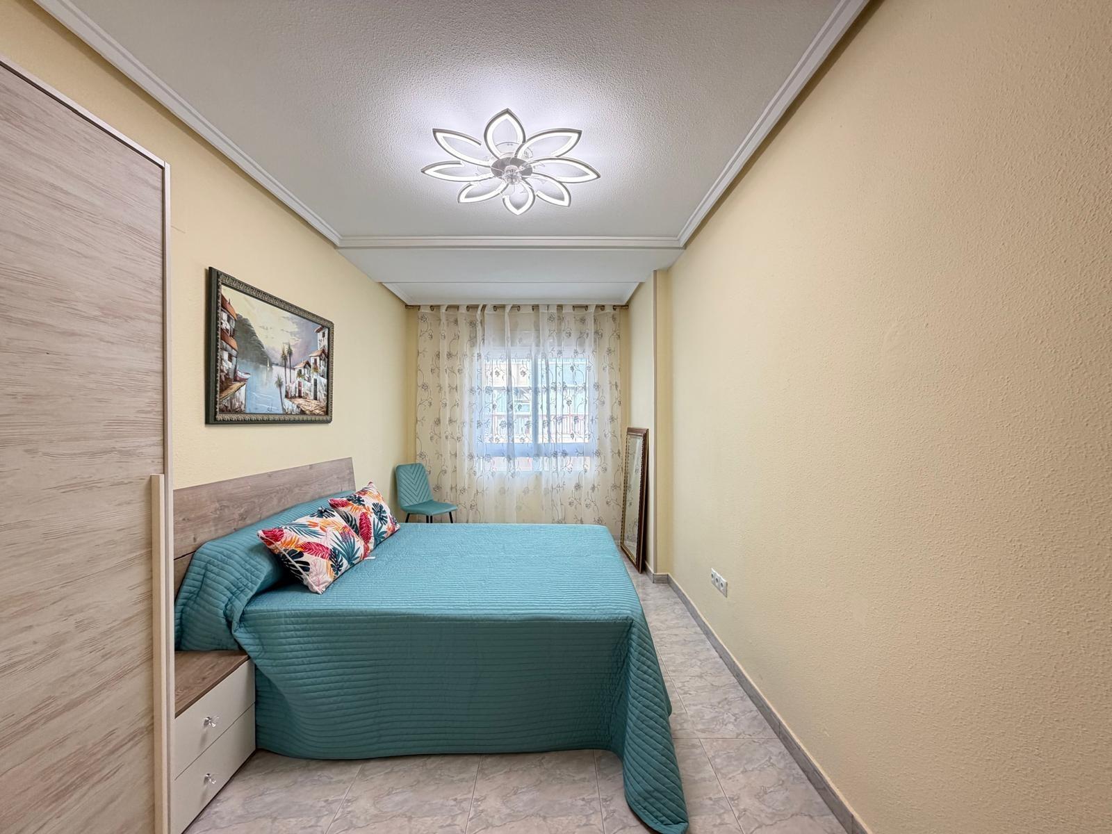 Kitchen sink and overhead storage cabinets, Playa del Cura apartment