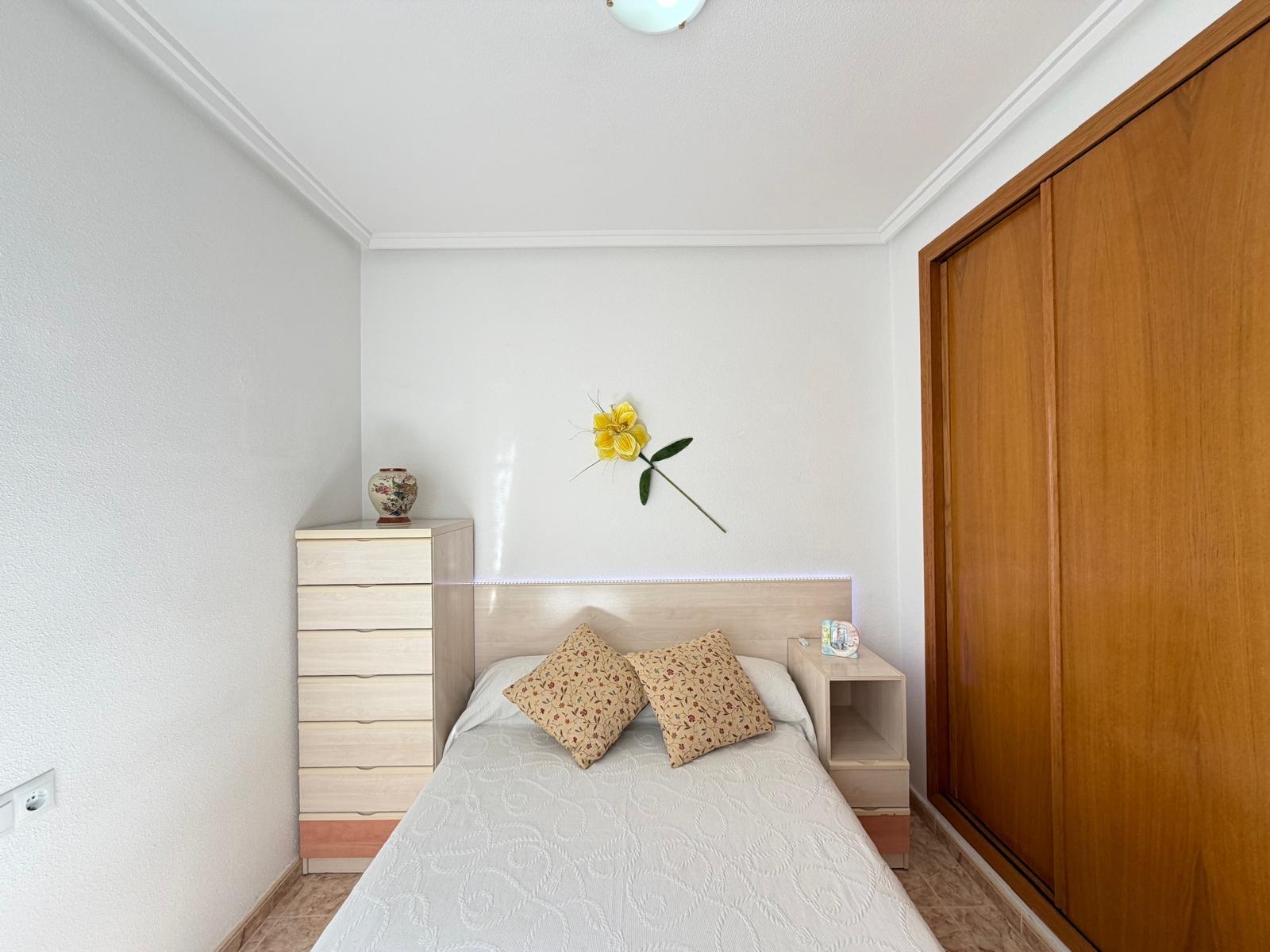 Bedroom with window and natural light in penthouse, Playa del Cura
